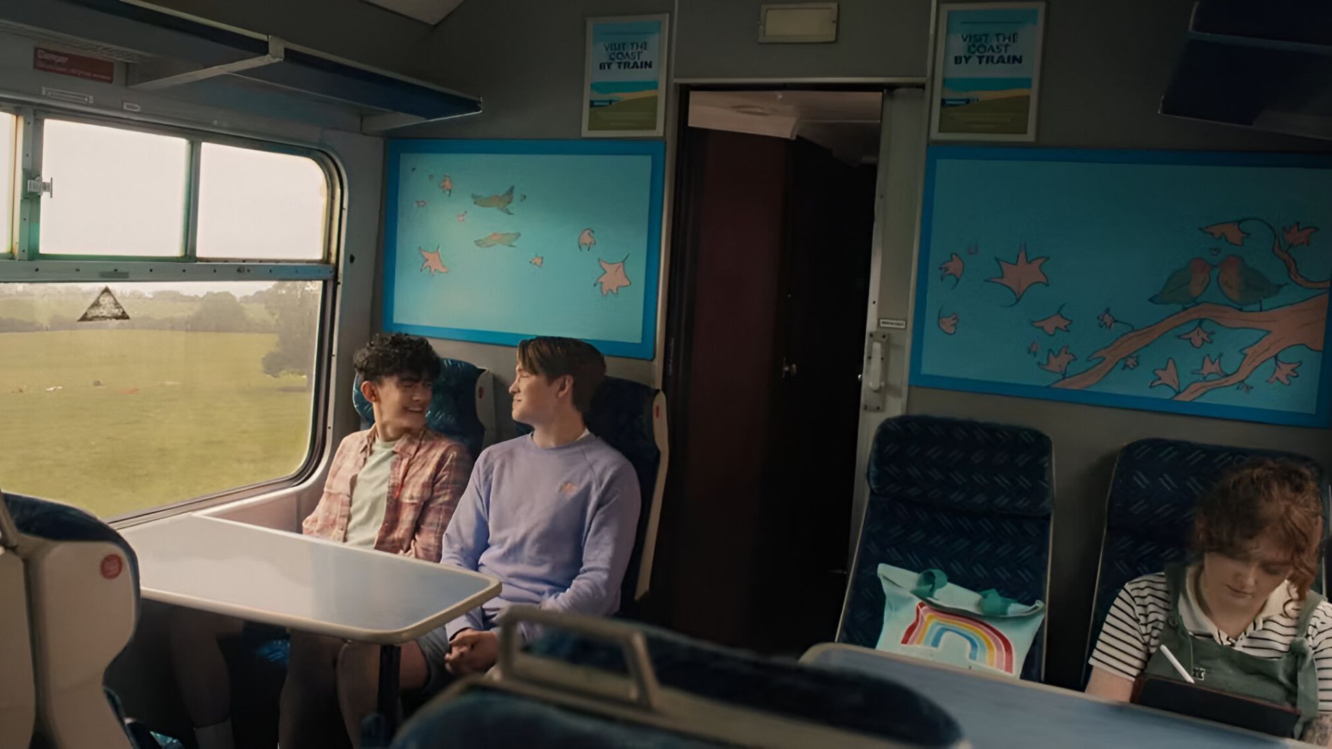 Charlie and Nick on a train (Image Source: Netflix)