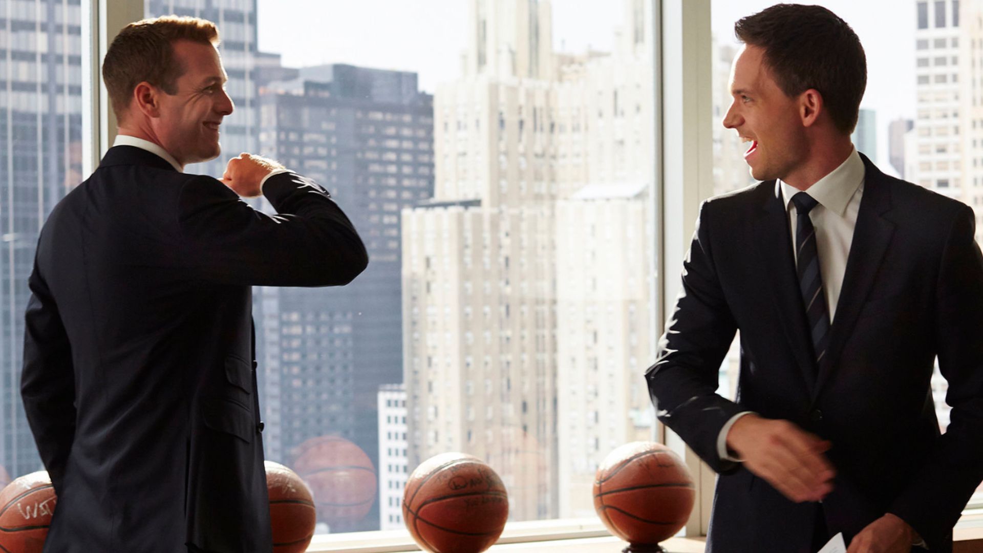 Mike Ross and Harvey Specter exchanging a handshake in his office | Image Source: Netflix