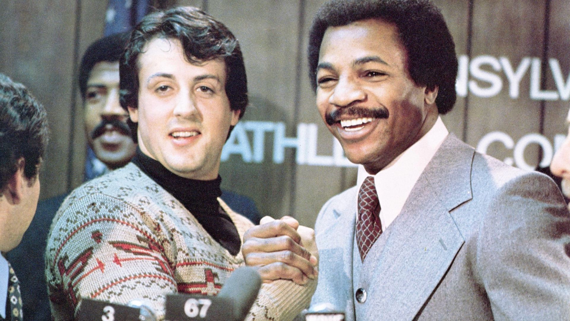 Sylvester Stallone, John G. Avildsen, and Carl Weathers (Image via United Artists/MGM)