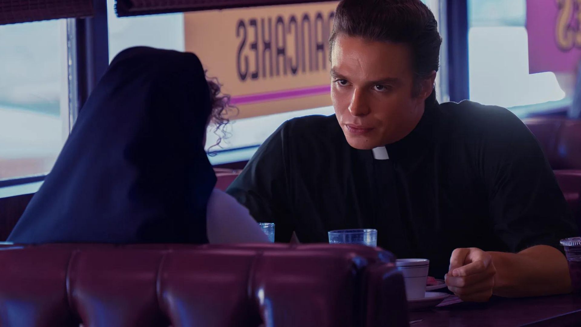 Sister Megan and Father Charlie at a local diner (Image Source: FX)