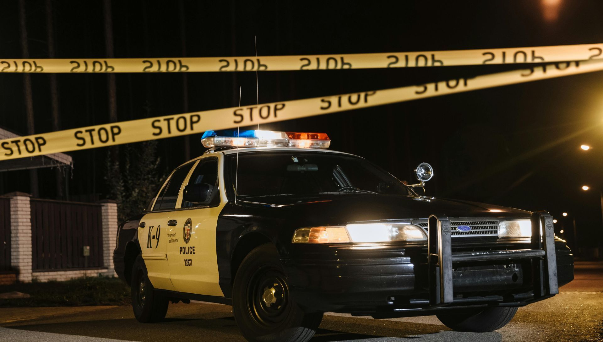 A Police Car Parked Beside the Crime Scene (Image via Pexels)