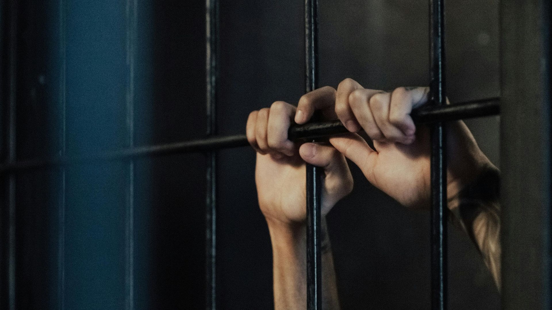 Man in a prison (Image via Pexels/Ron Lach)