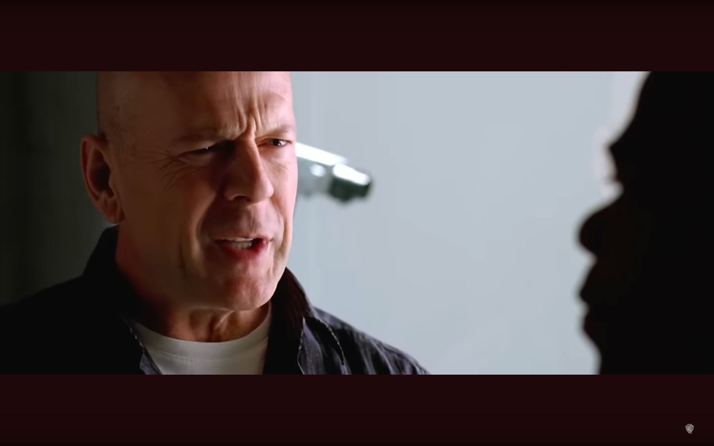 Still of Bruce Willis (Image via Warner Bro. UK and Ireland)