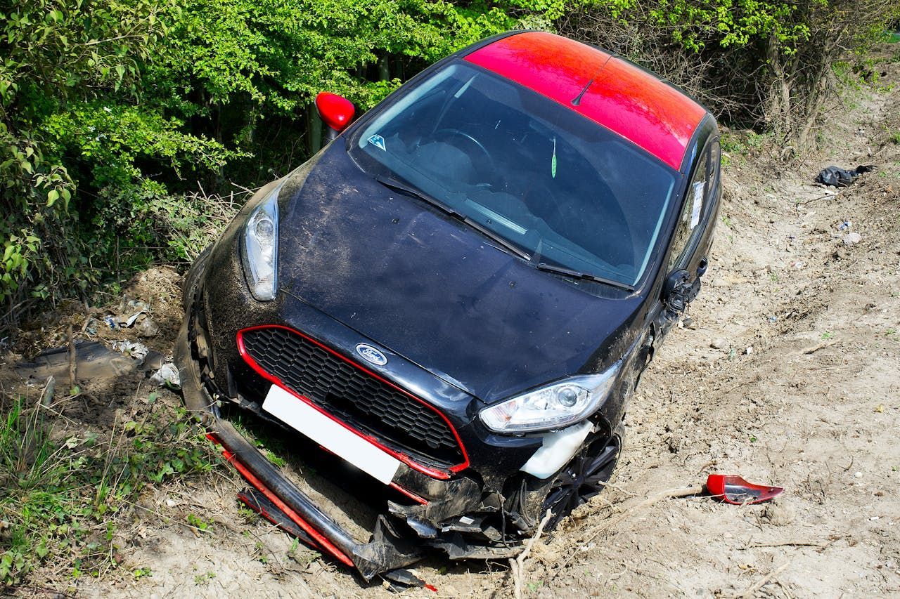 Car Crash on Dirt Road (Image via Pexels)