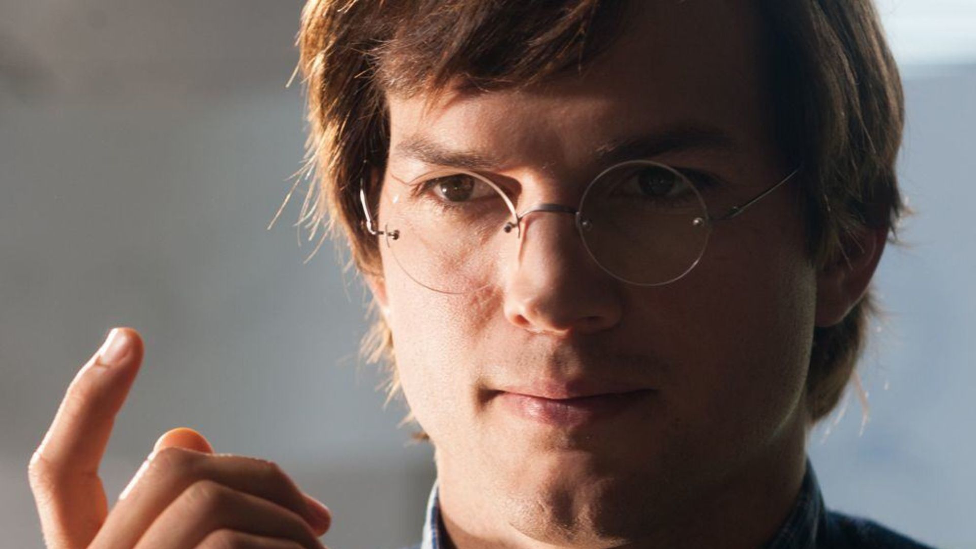 Ashton Kutcher in and as Jobs | Image Source: Apple TV+