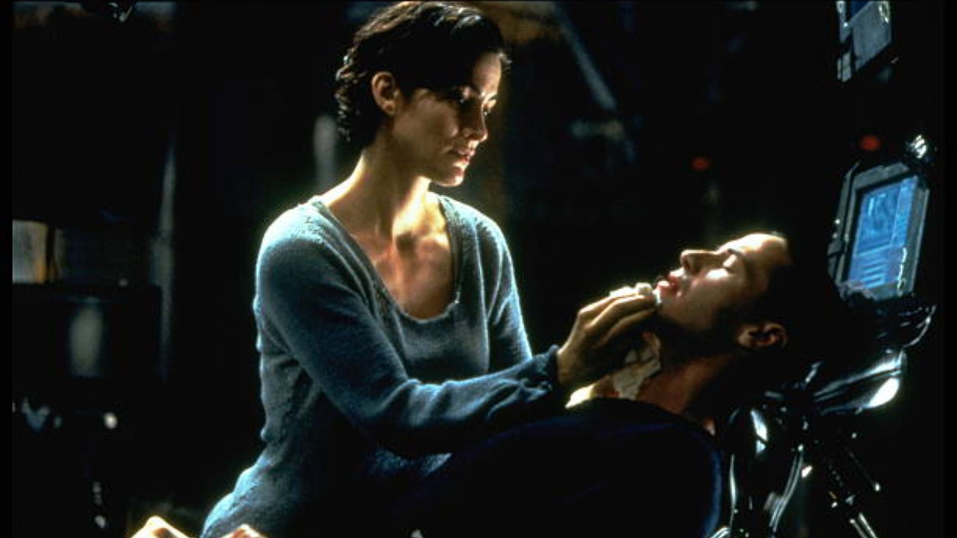 Anne Moss and Keanu Reeves in The Matrix / Image Source: Getty