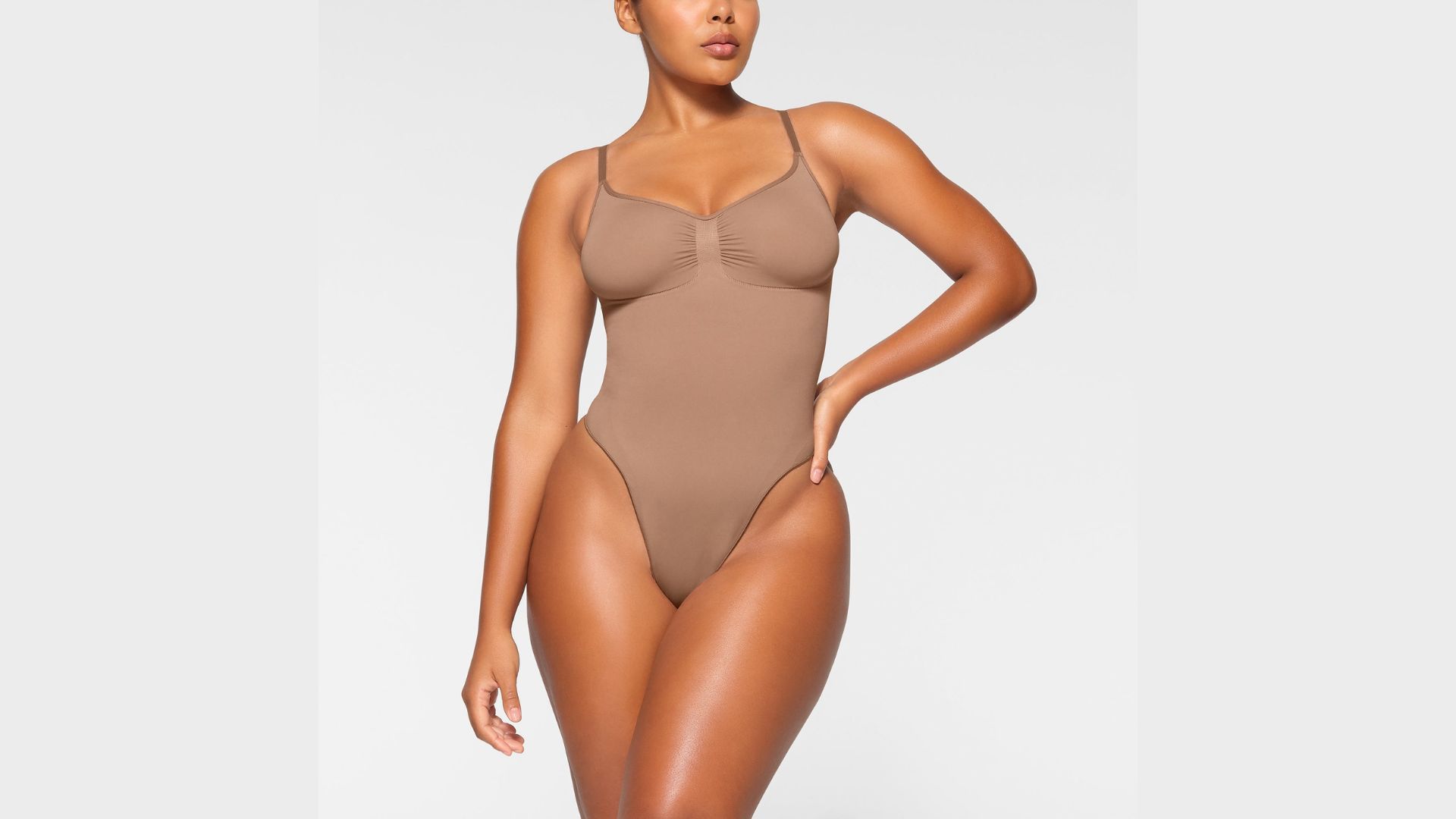 The thong bodysuit is perfect for cinching your waist and flattering your bust (Image via Skims)