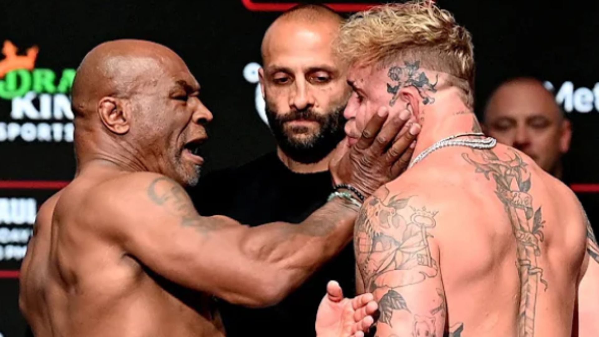 Mike Tyson slapping Jake Paul during their face-off / (Image via ESPN)