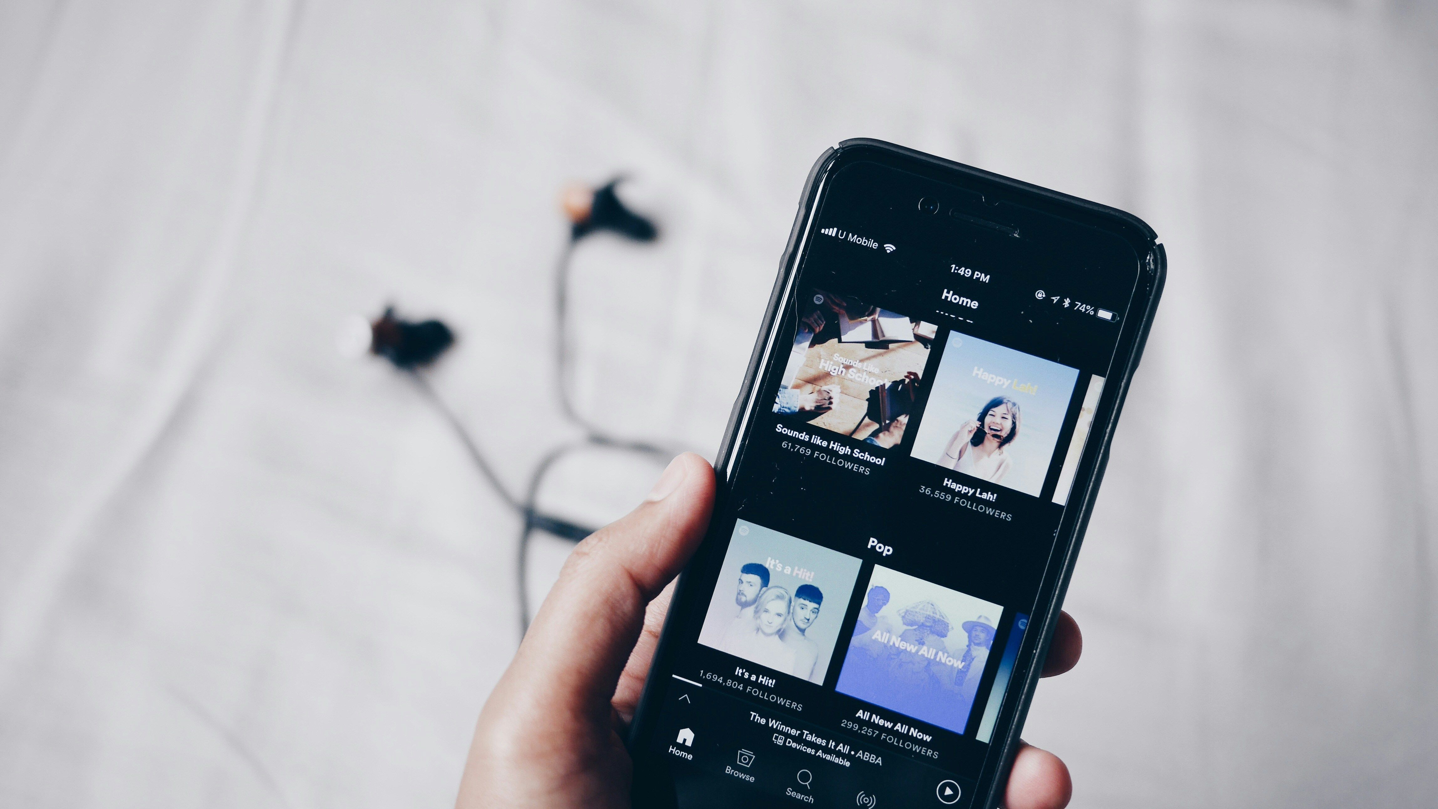 Spotify on laptop image via Fath on Unsplash 