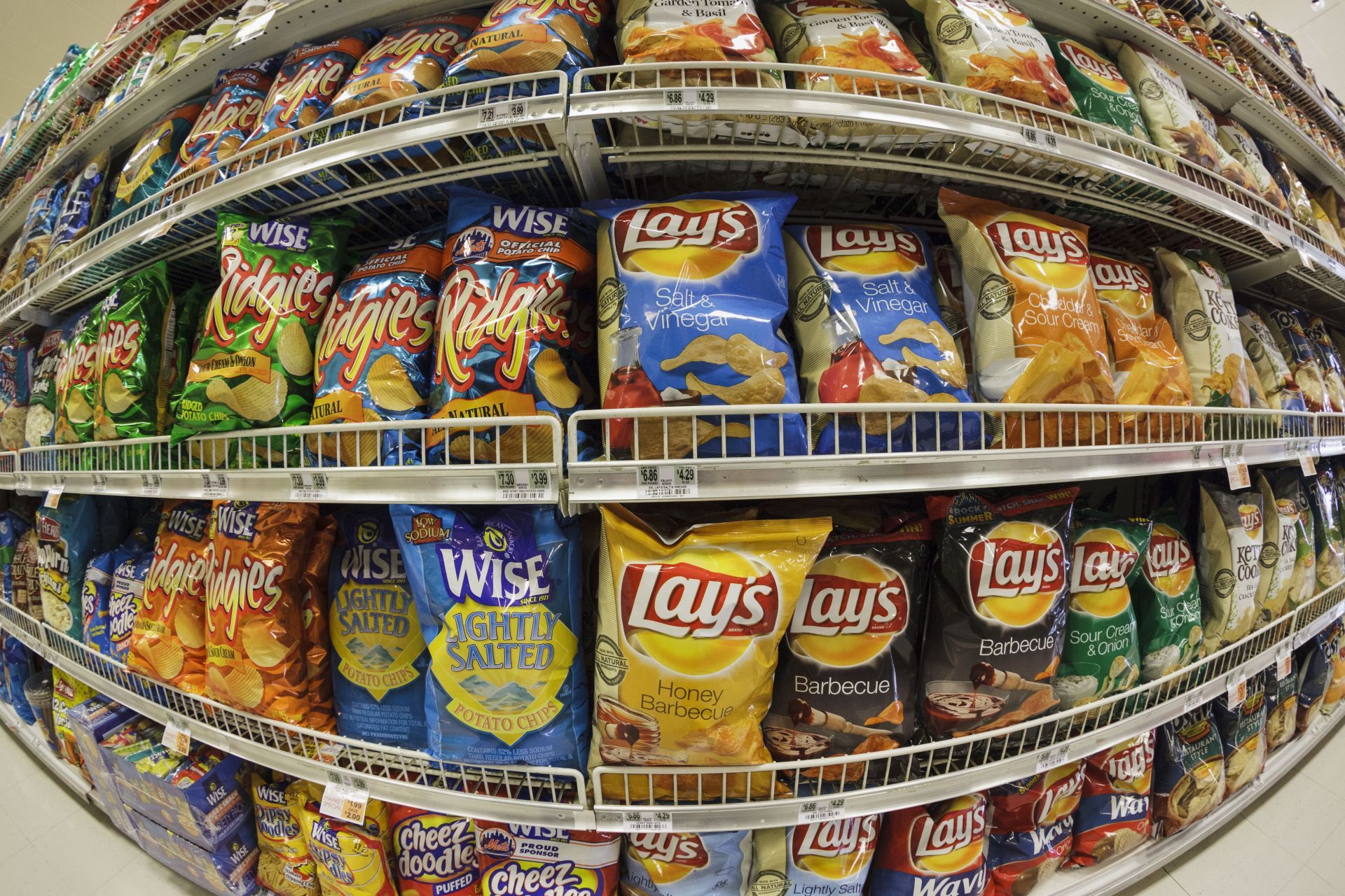 Snack chips on a supermarket shelf - Source: Getty