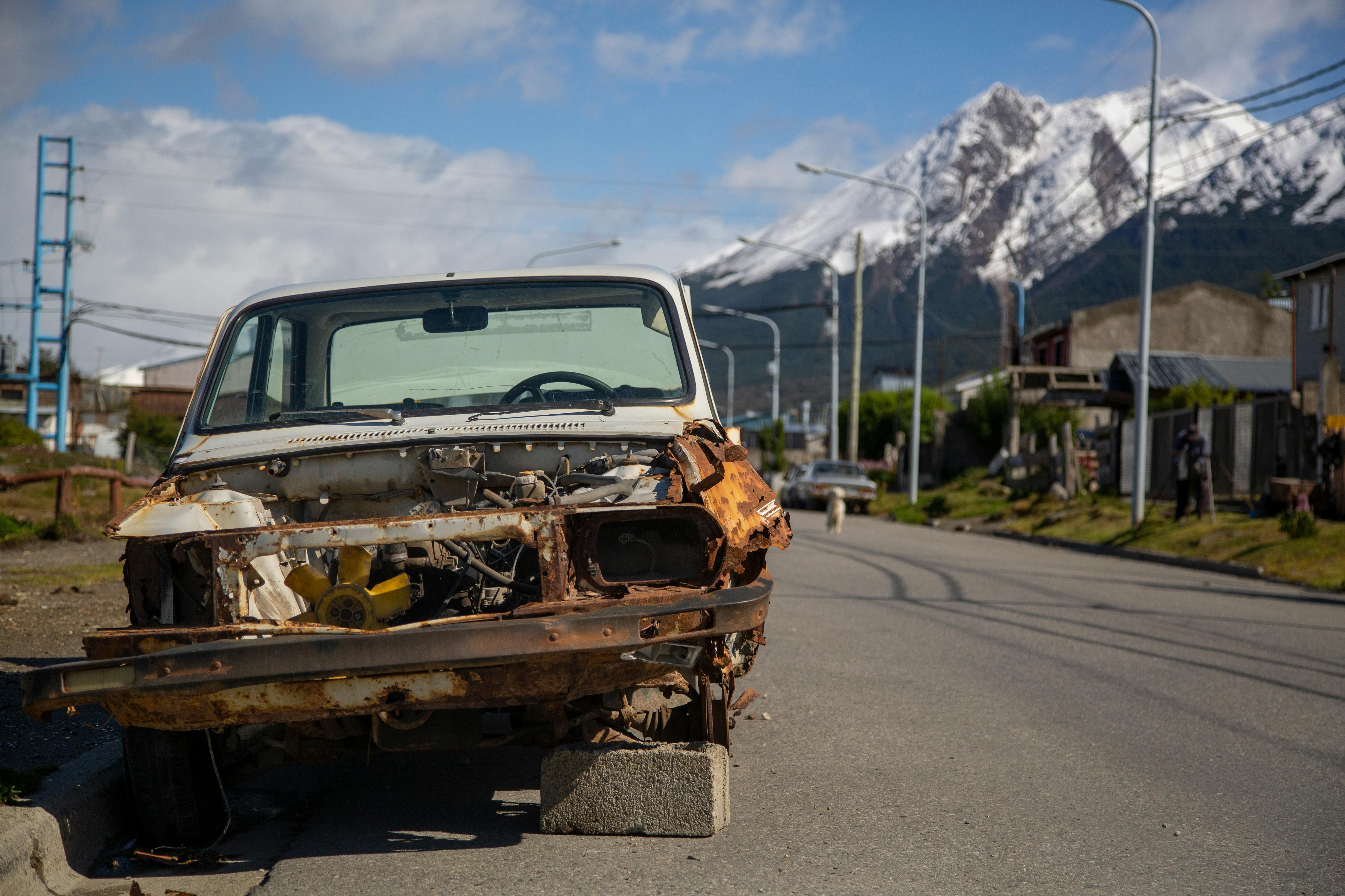 A Broken Car Parked Outside (Image via Pexels)