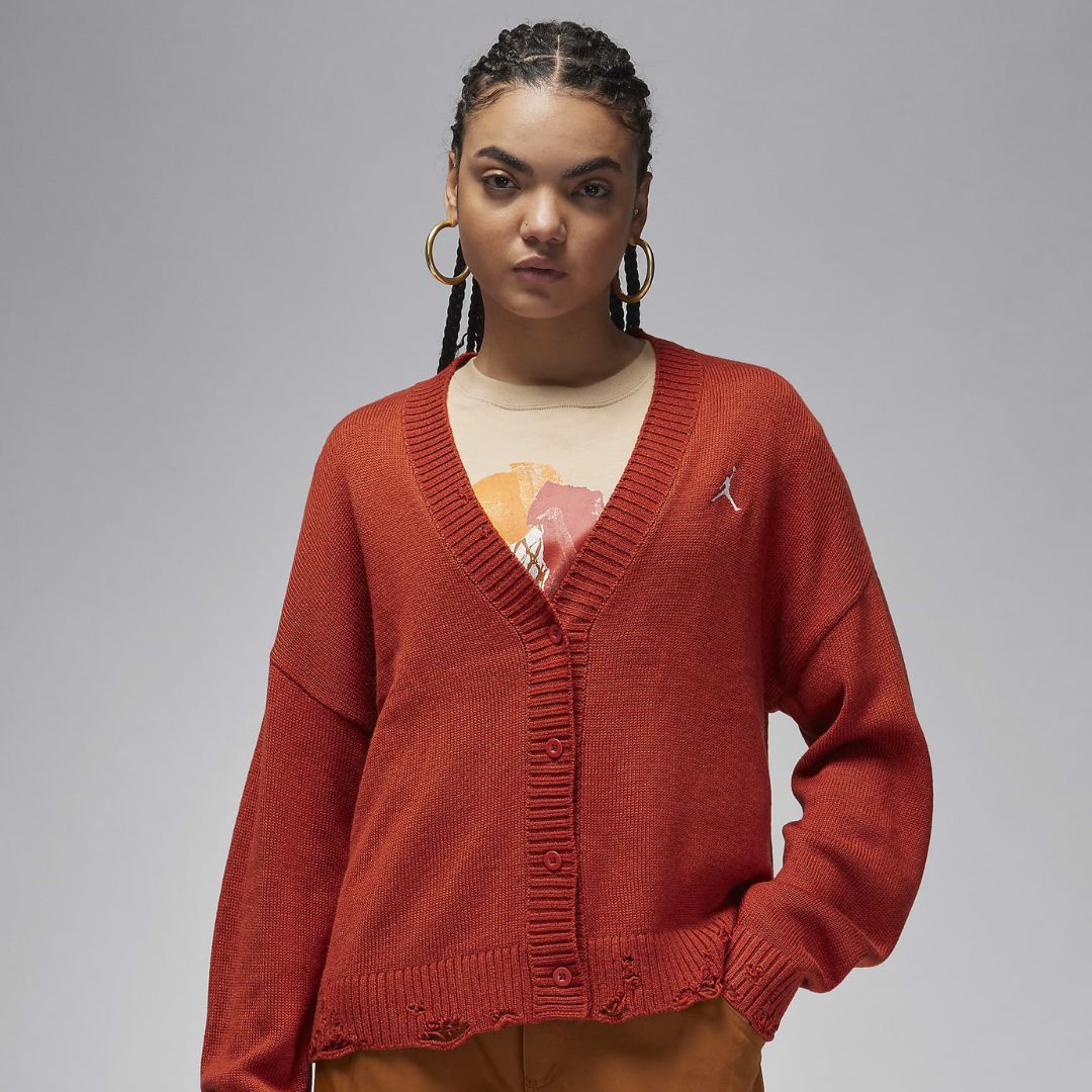 Jordan Women&#039;s Distressed Cardigan in Dune Red / Sail (Image via Nike)