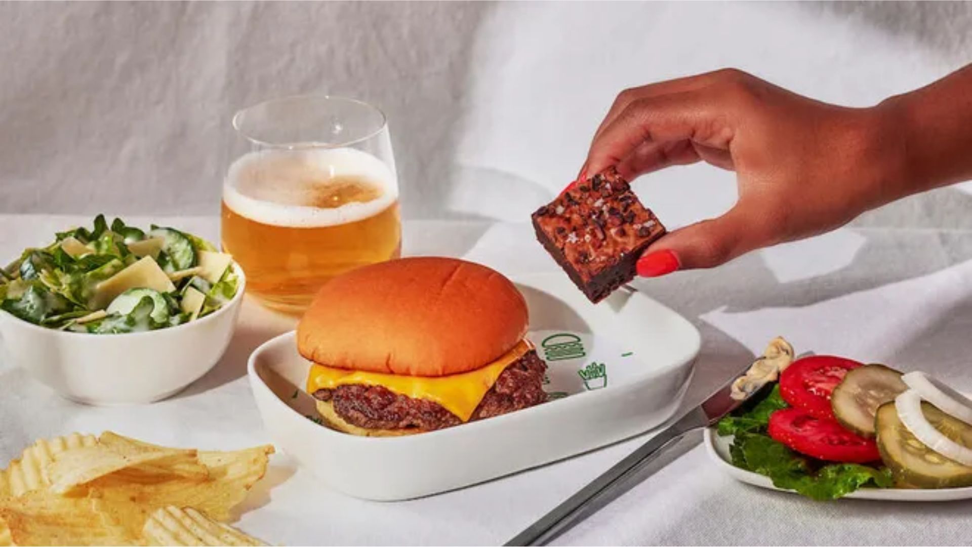 Flyers can now enjoy a Shake Shack burger on their Delta Airlines flight (Image via Delta Hub)