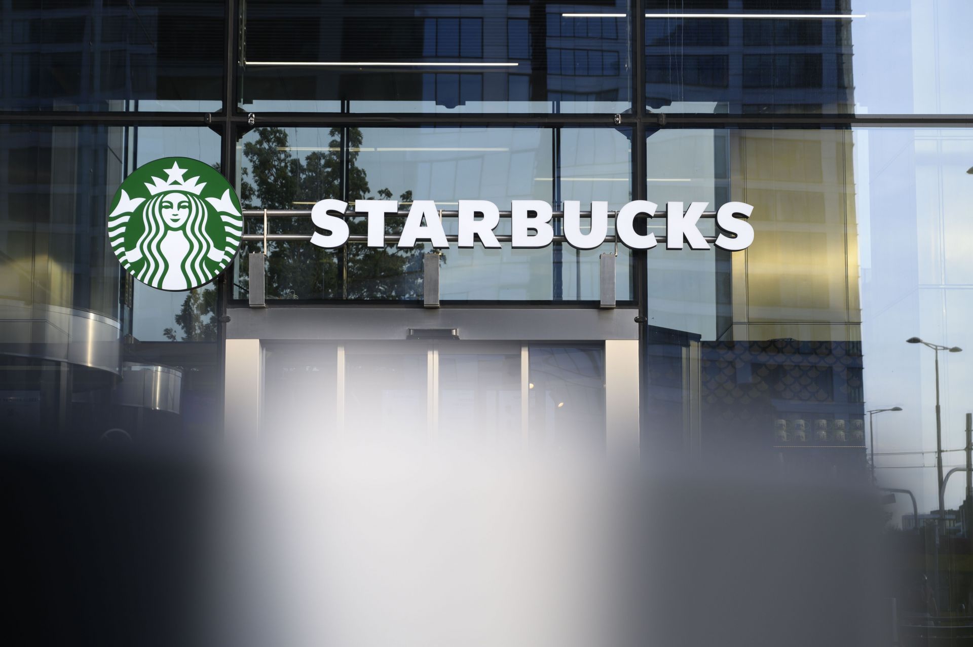 Starbucks Coffee Signage And Logo. - Source: Getty