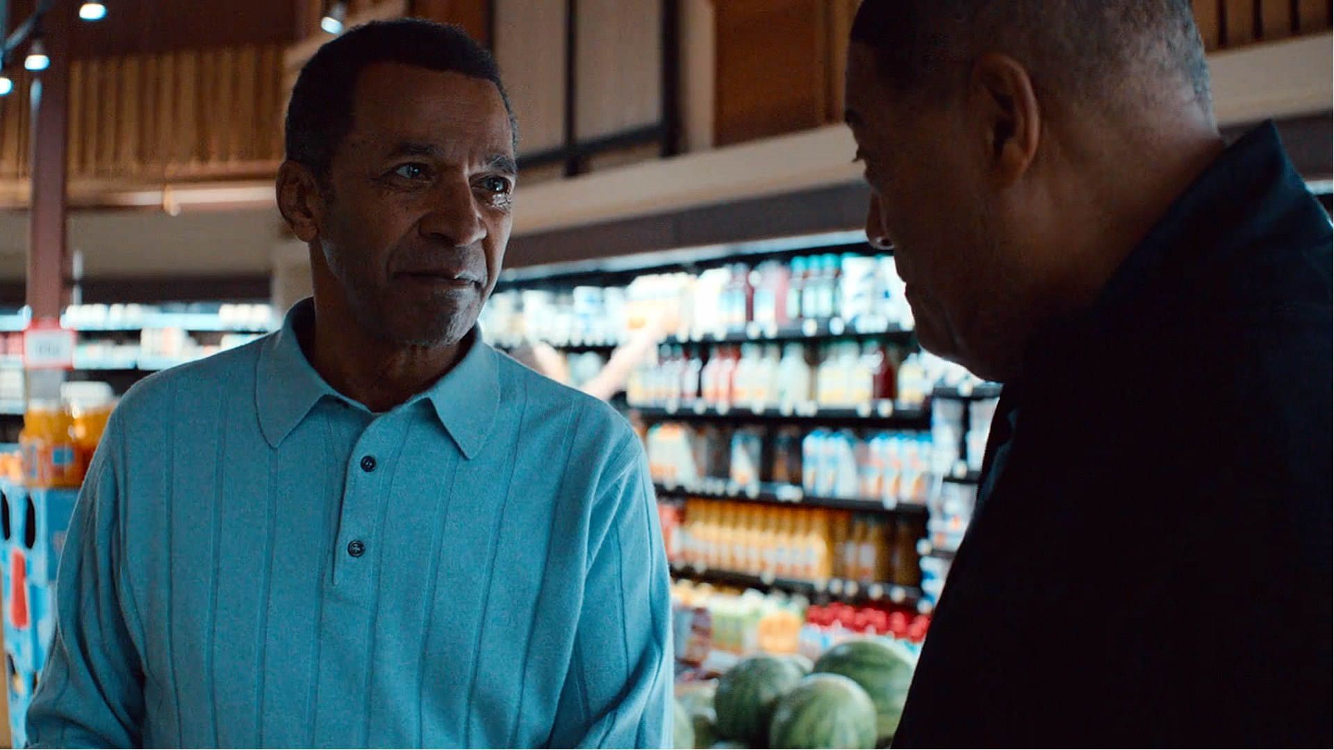 Clifton Davis talking to Lawrence Fishburne in Clipped. | Image Source: Hulu