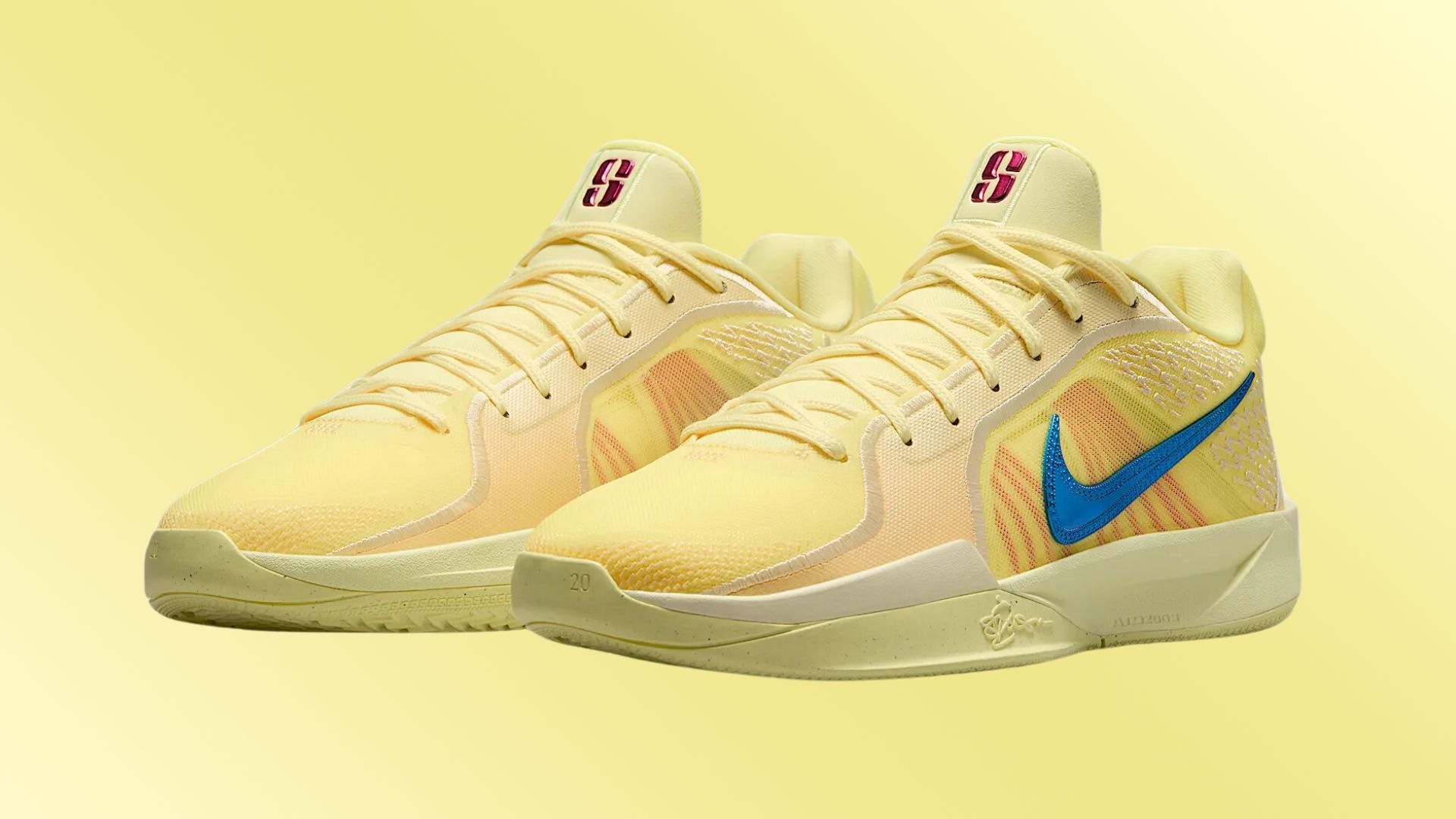 The monochromatic yellow hue of the Citron Tint is highlighted by blue and deep rose colored Swooshes, artfully placed on each shoe (Image via Nike)