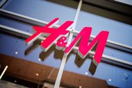 Logo of the fashion company H&M on a store - Source: Getty