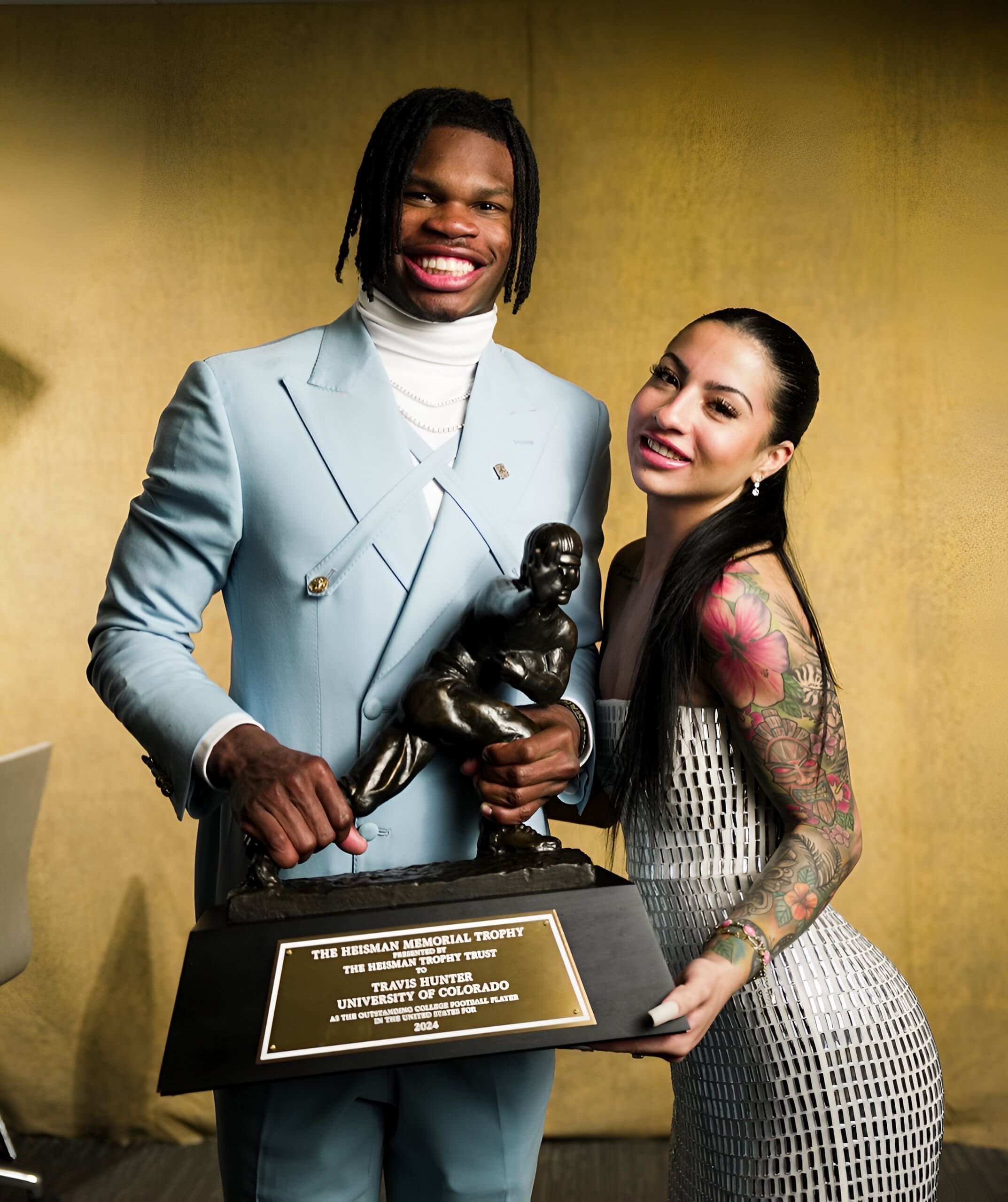 Travis Hunter and Leanna Lenee pose together at the Heisman Award ceremony (Image via Instagram/@db3_tip)