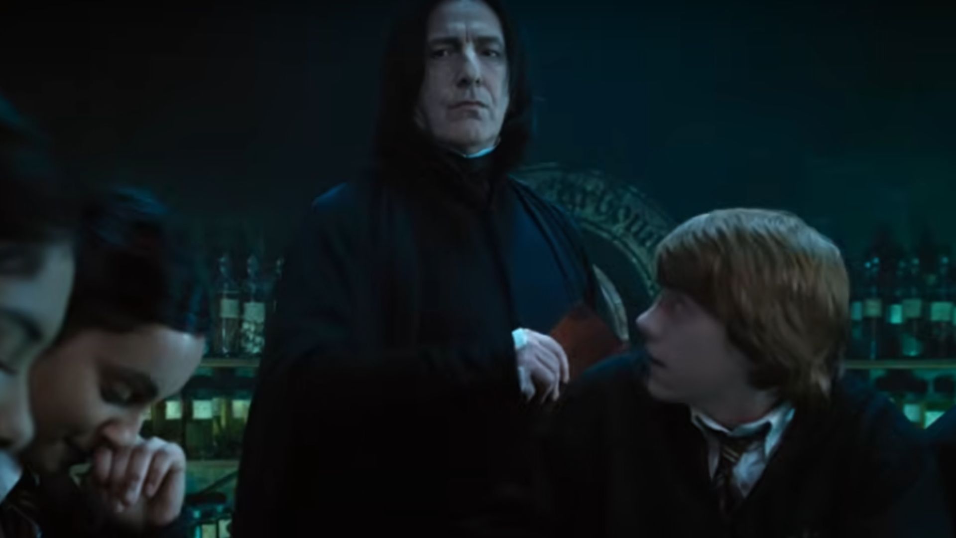 Severus Snape hitting Ron Weasley with a book | Image Via: Warner Bros. Pictures