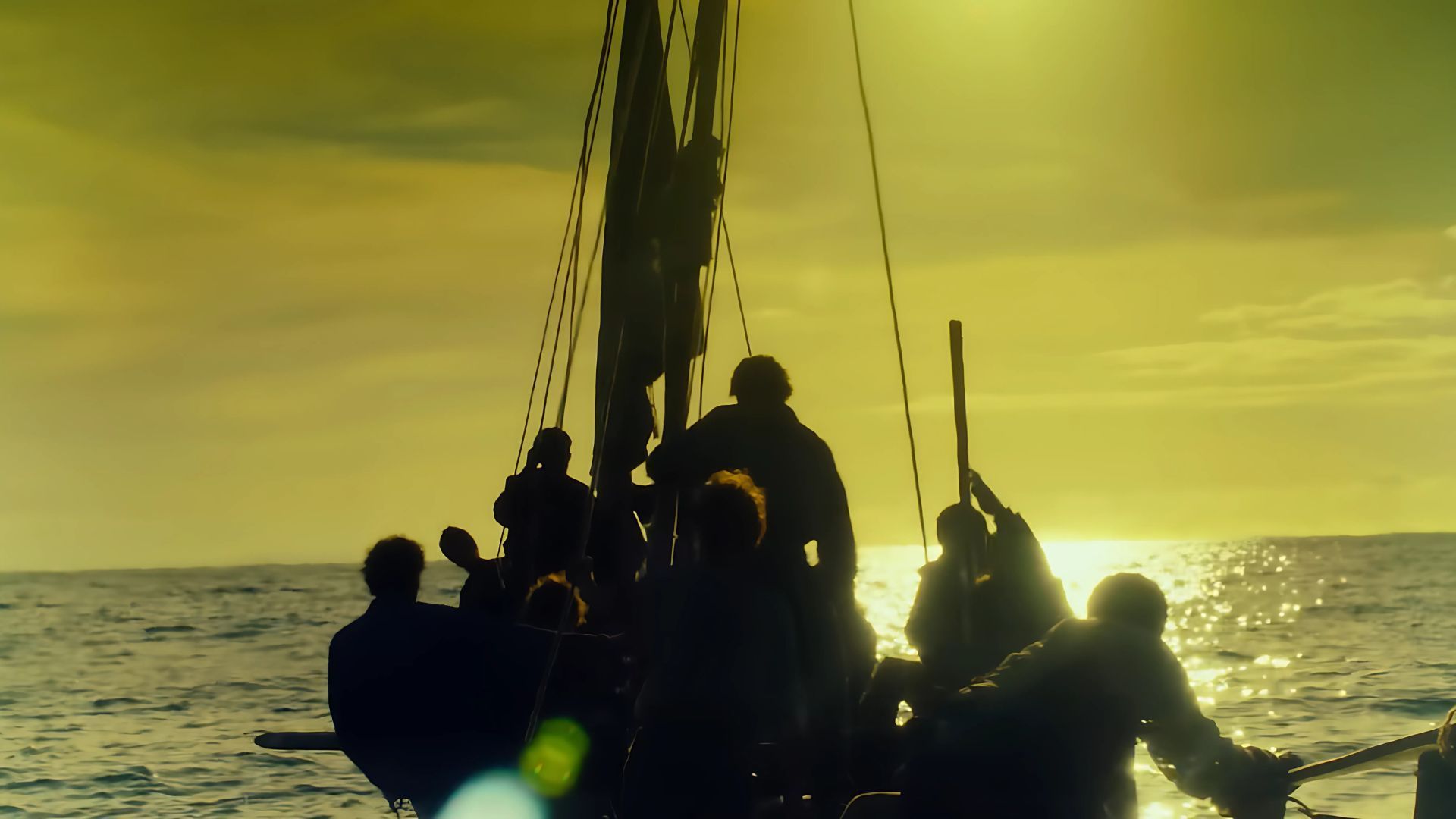 A few sailors are seen on a boat