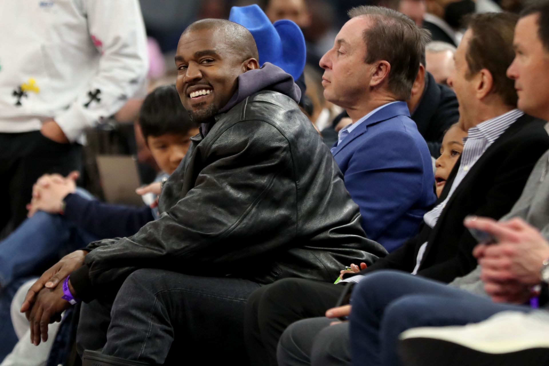 Kanye West and son watch game with Golden State Warriors co-owners - Source: Getty