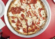 Half plain and Half pepperoni pizza (Image via Instagram/@totonnospizza)