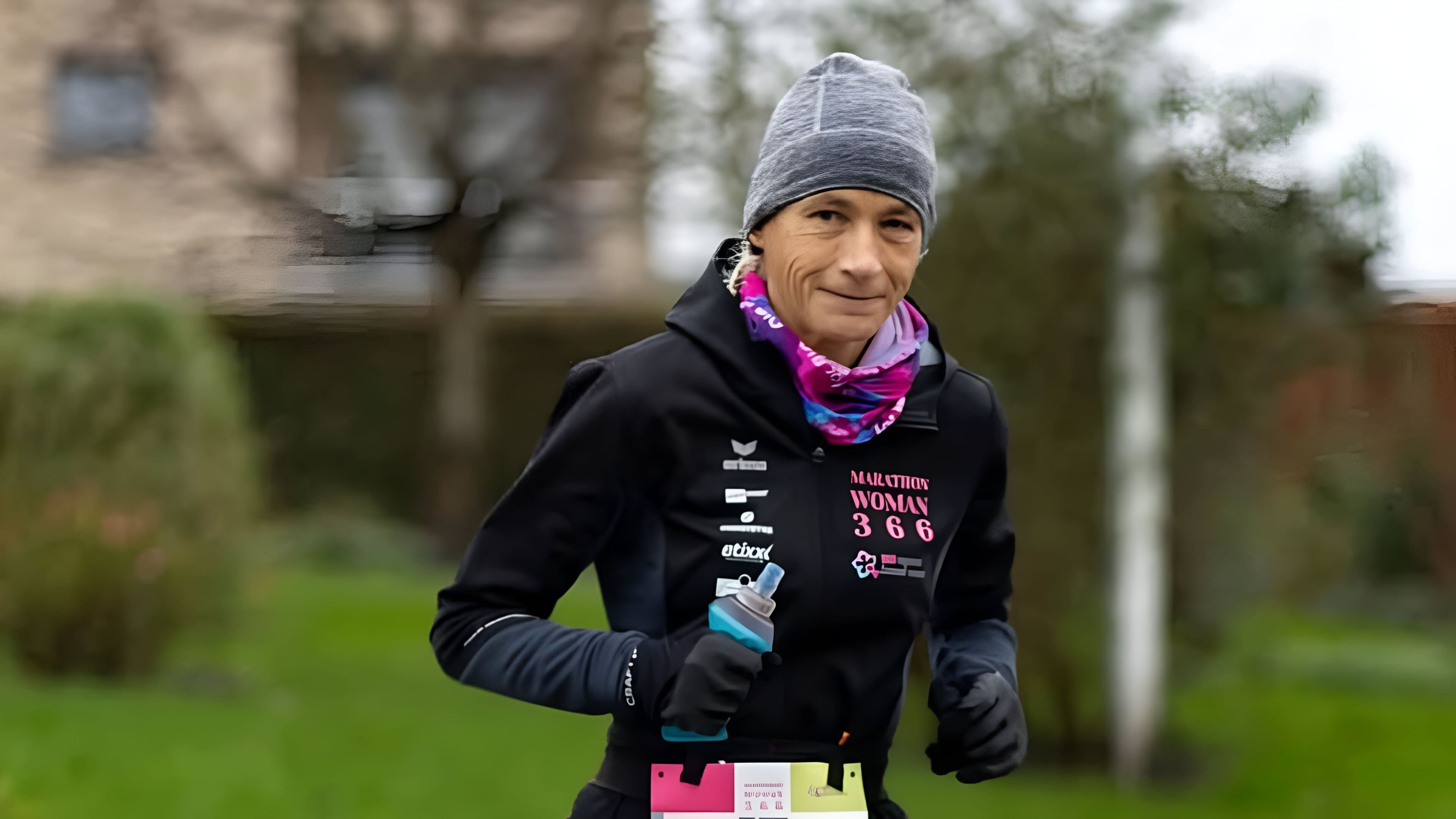 Hilde Dosogne running a marathon in Lochristi, Belgium (Image via Instagram/@marathonwoman366)