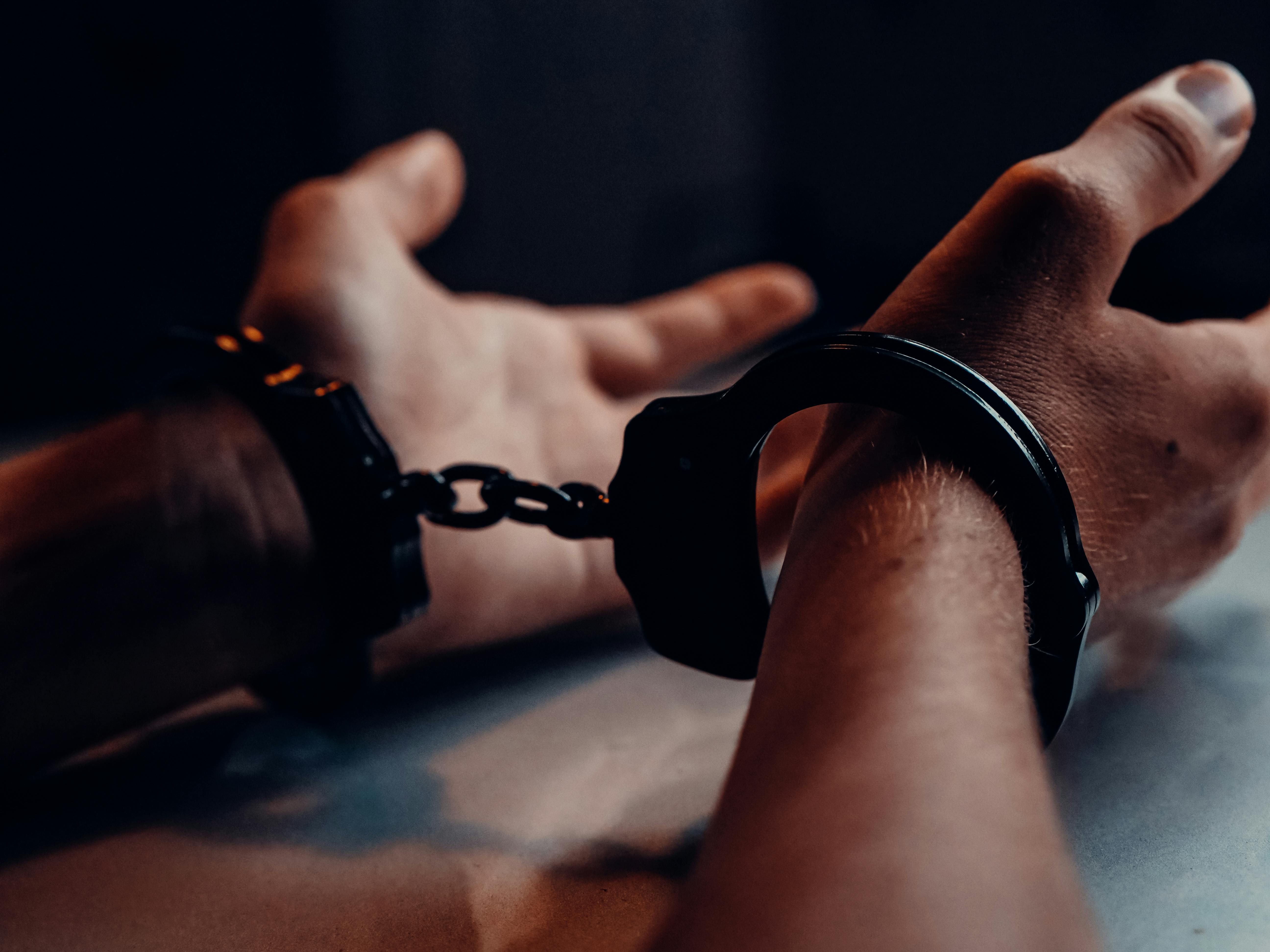 Man In Handcuffs (Image via Kindel Media / Pexels)