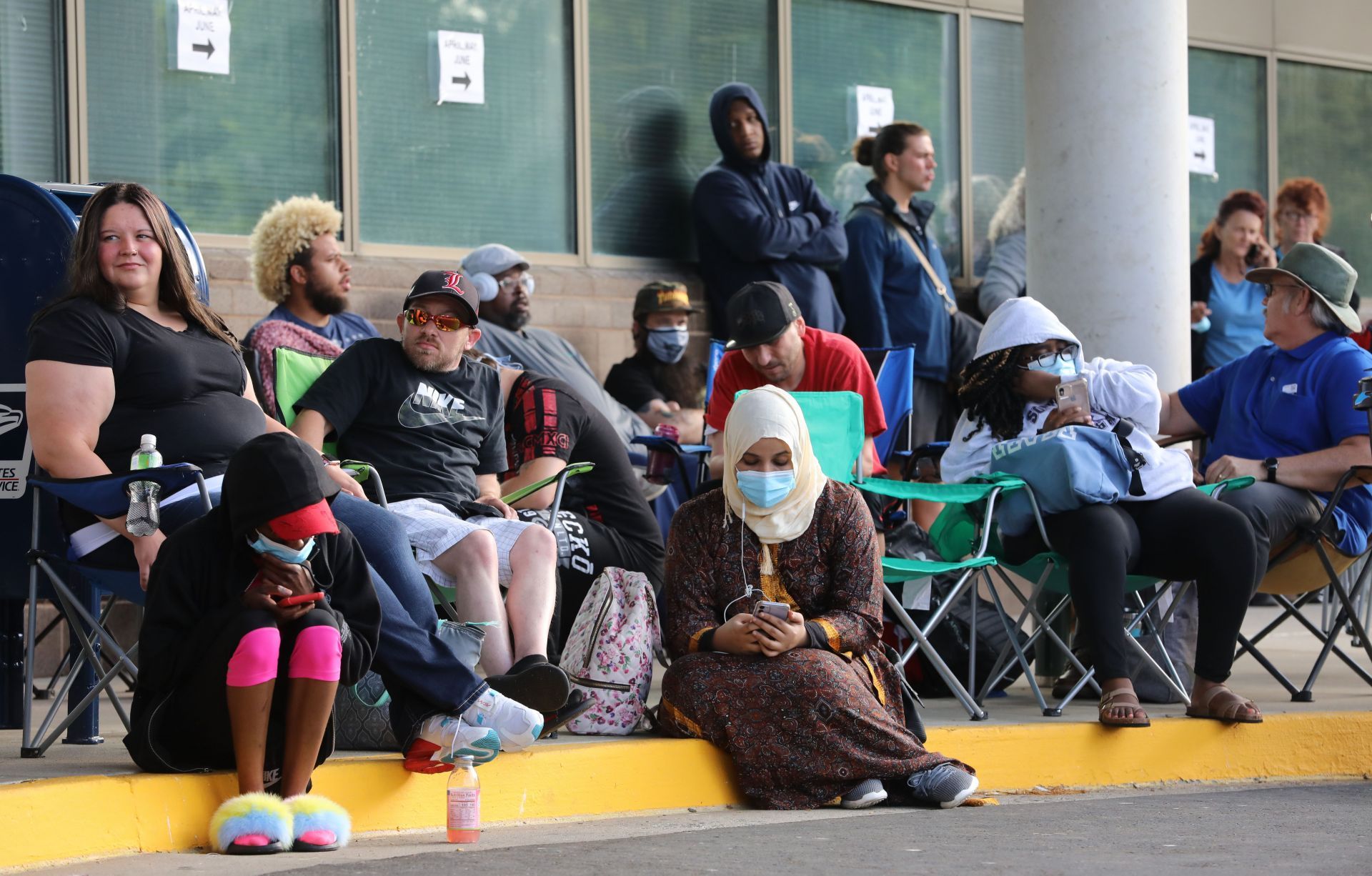 People Wait In Line To File For Unemployment Benefits In Frankfort, Kentucky - Source: Getty