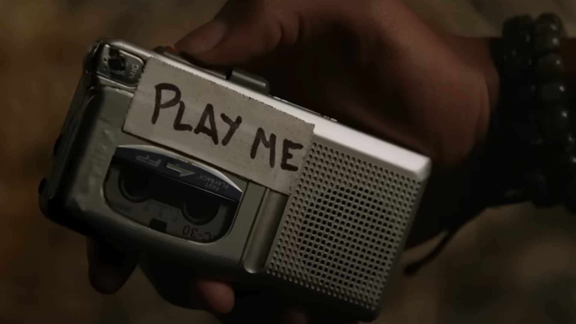 A tape with a tape on it with the following words written on it: Play Me