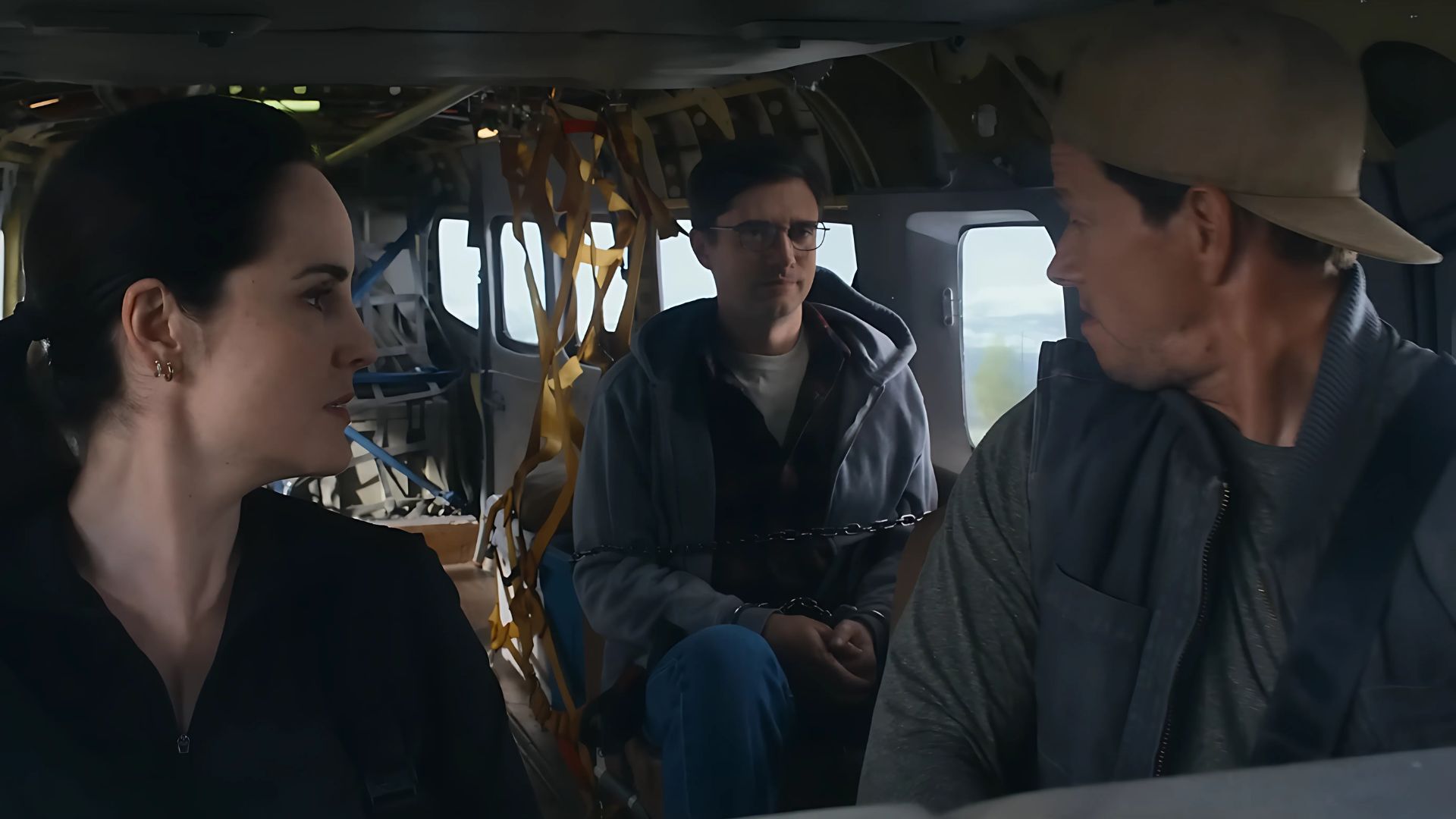 Mark Wahlberg, Topher Grace, and Michelle Dockery, are in a plane