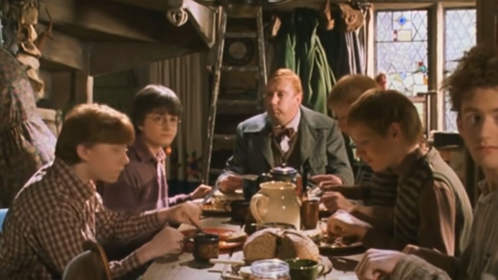 Harry&#039;s first meal with the Weasley family | Image Via: Warner Bros. Pictures