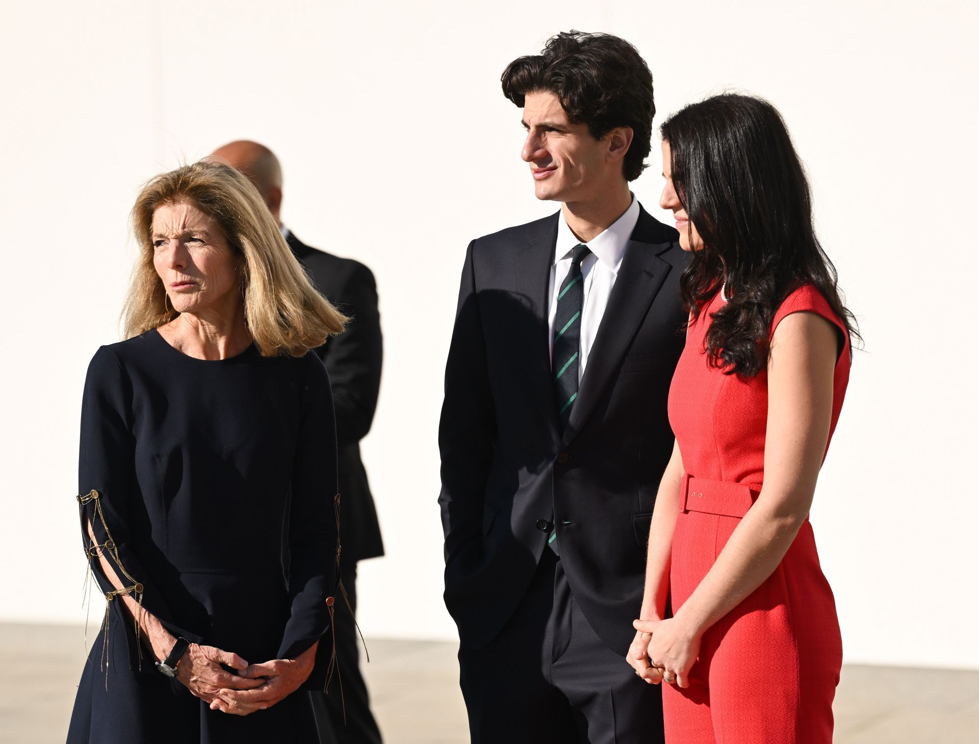 Caroline Kennedy with her children Tatiana (in red) and Jack Schlossberg at an event in Boston, 2022 (Image via Getty)