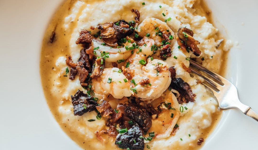 Shrimp &amp; Grits from La Petite Grocery. (Image via Instagram/@lapetitegrocery)