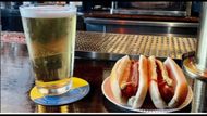 Hot dog and beer at Rudy's (Image via Instagram/@rudysbar)