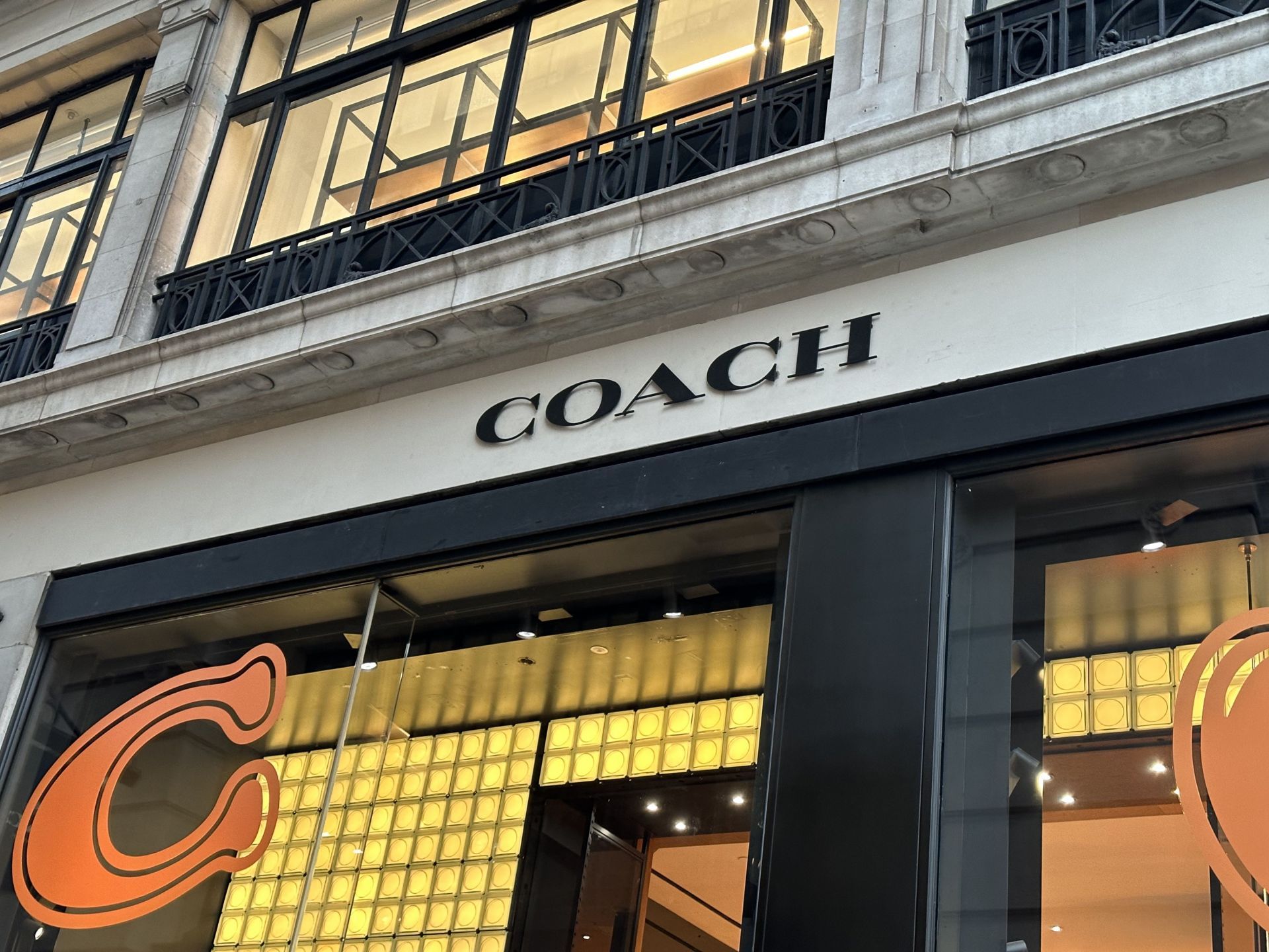 Coach store sign on building exterior - Source: Getty