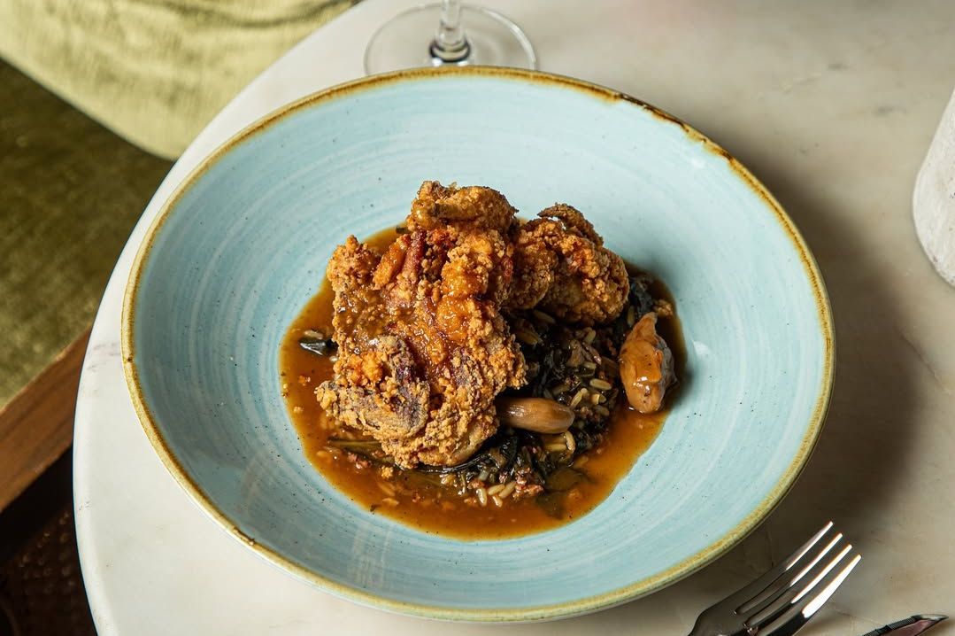 Dirty Rice Stuffed Quail collard greens, mushroom gravy from Jack Rose. (Image via Instagram/@jackrosenola)