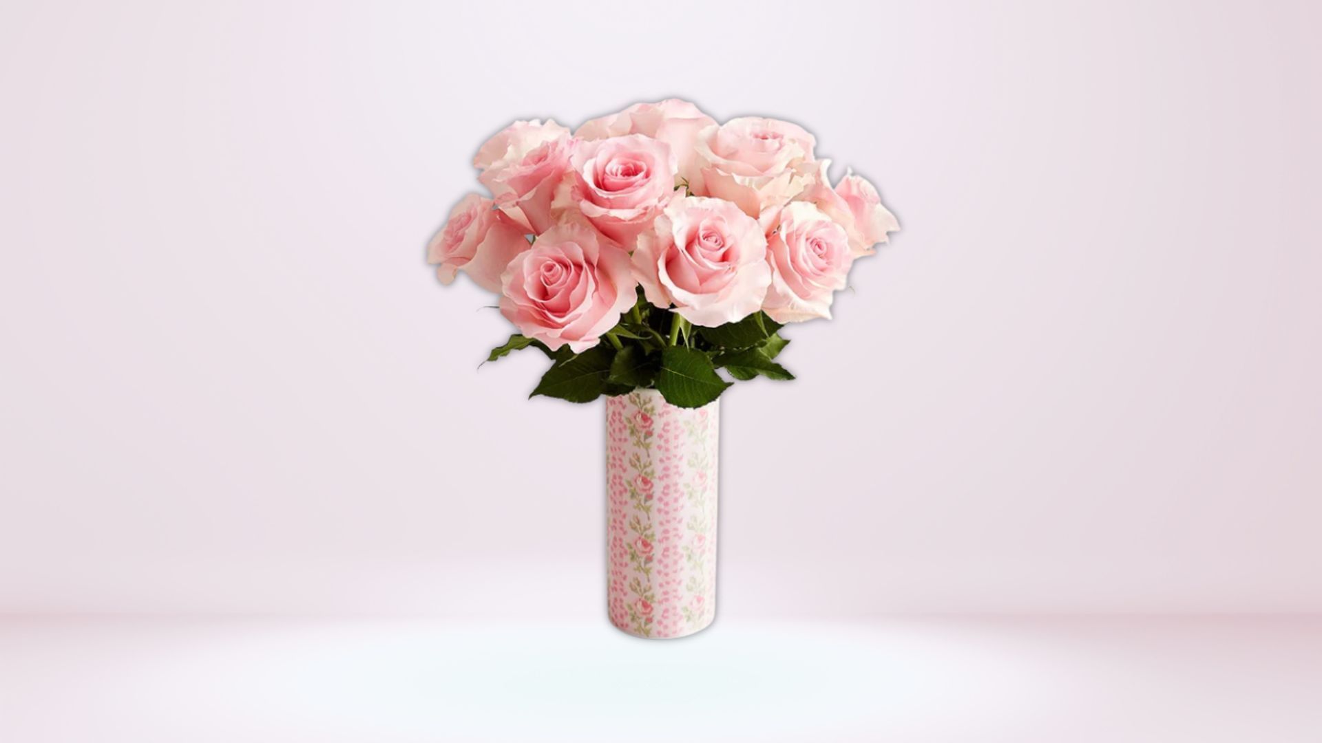 This bouquet arrangement features 12 pink roses (Image via 1-800-Flowers)