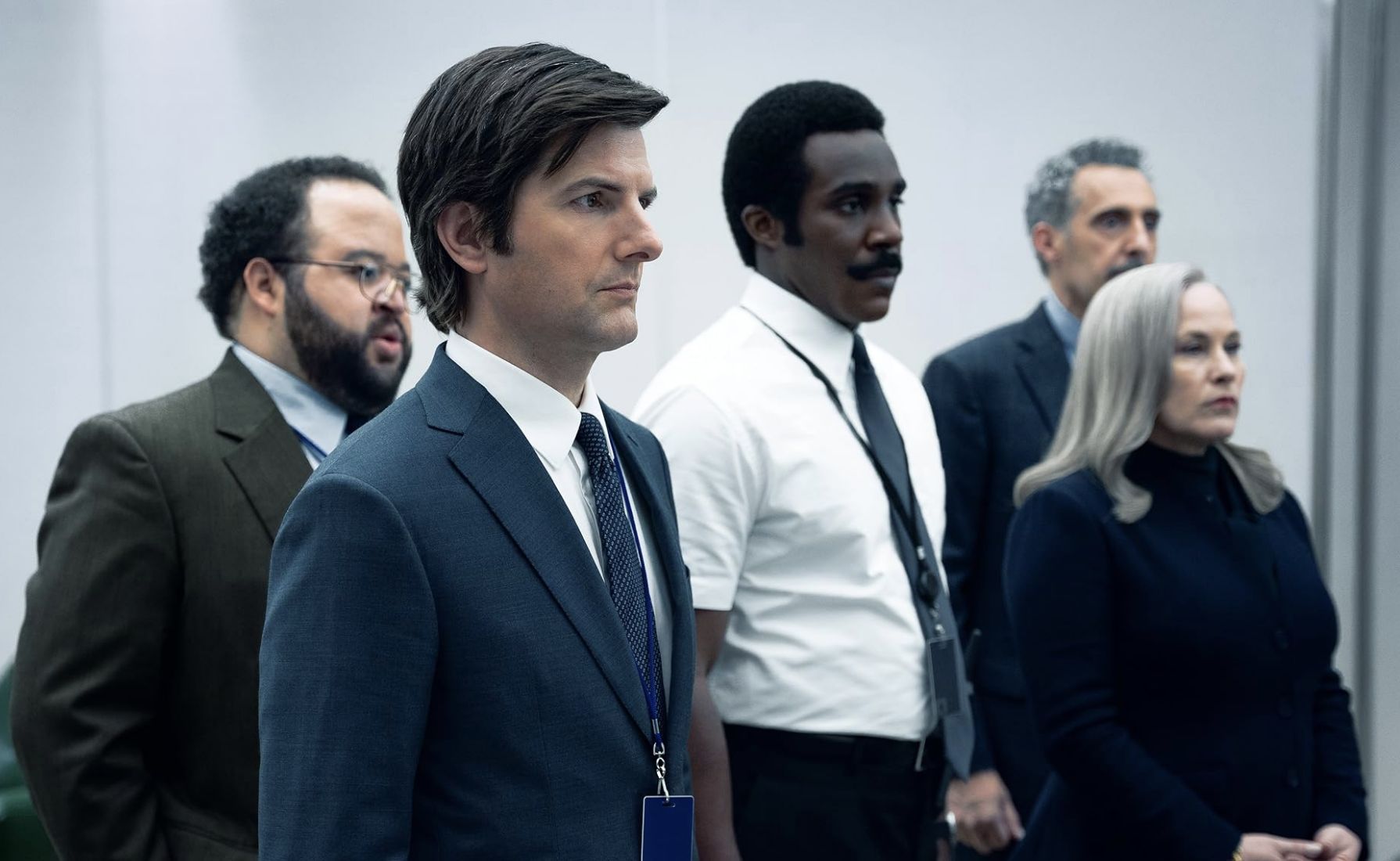 Zach Cherry with his co-actors on Severance (Image via Apple TV+)