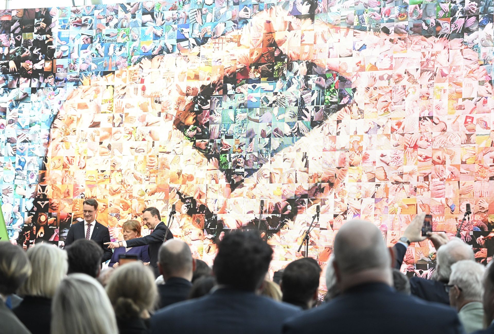 Angela Merkel&#039;s famous &quot;Merkel-Raute&quot; hand posture (Image via Roberto Pfeil/picture alliance via Getty Images)