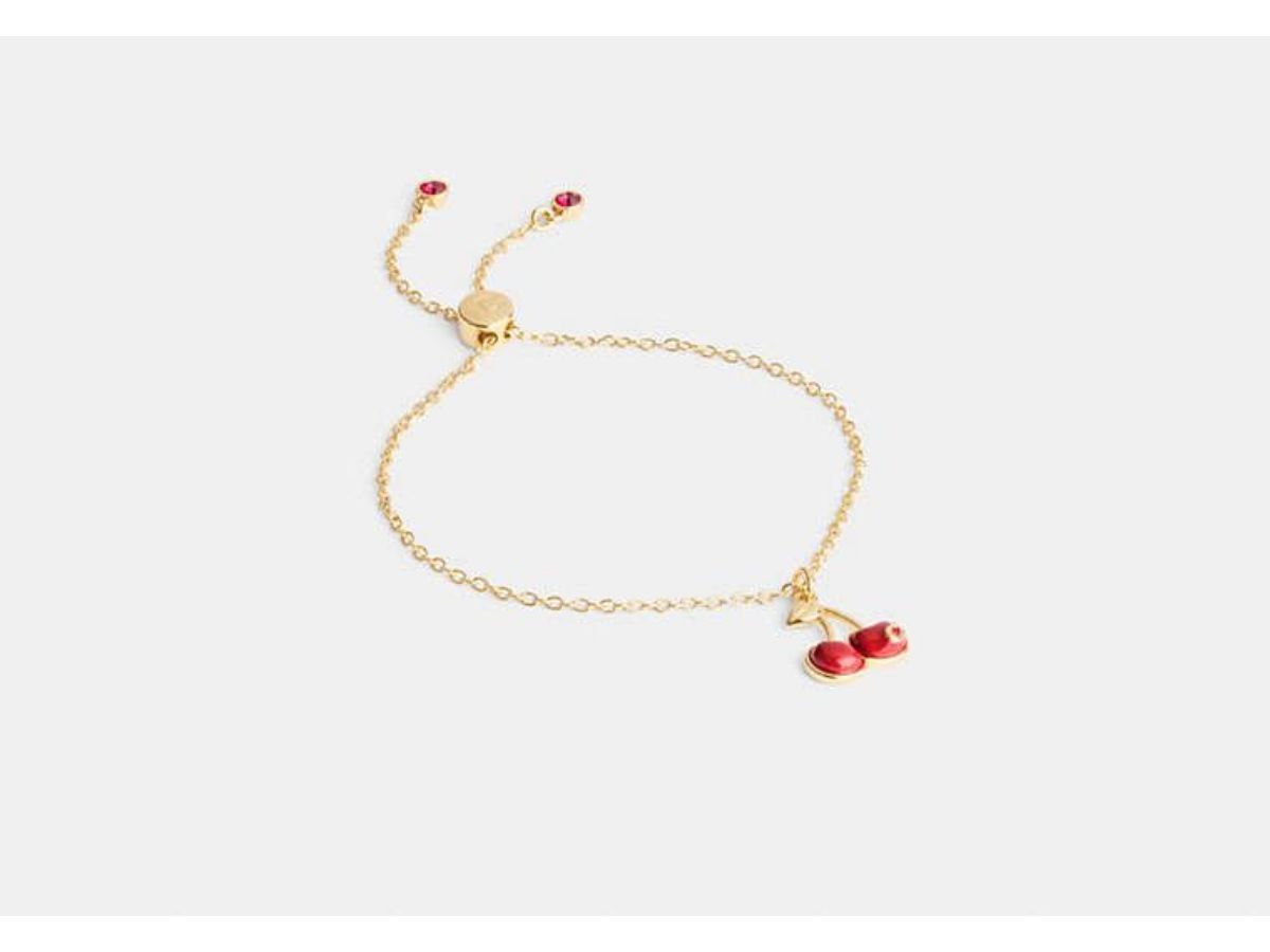 Cherry Charm Slider Bracelet (Image via Coach)