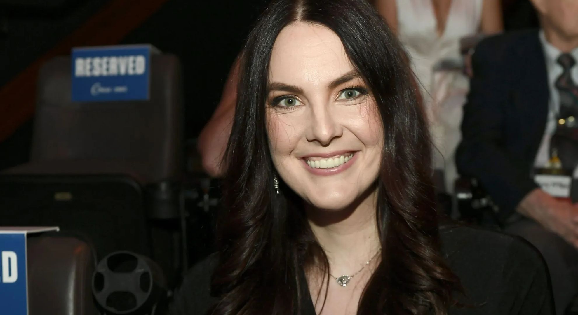 Ashley St. Clair pays tribute to Bob Martin at the Sports Gambling Hall of Fame ceremony in Las Vegas. (Image via Getty/Bryan Steffy)
