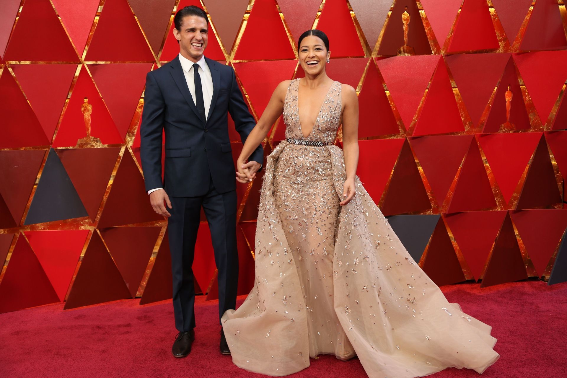 Gina Rodriguez and Joe LoCicero at the 90th Academy Awards - Red carpet. (Image Source: Getty)