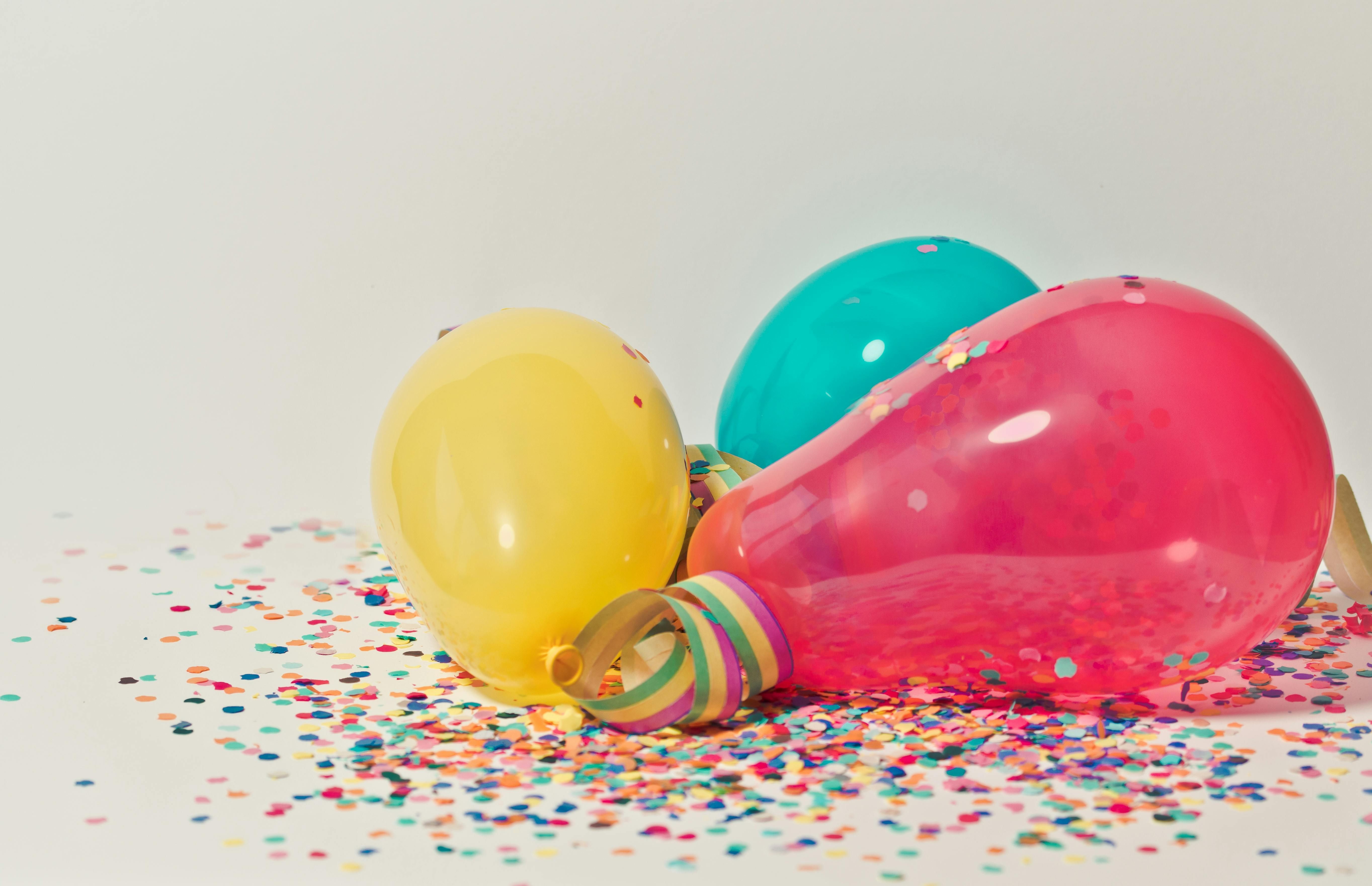 Colorful Balloons with Confetti (Image via Pexels)