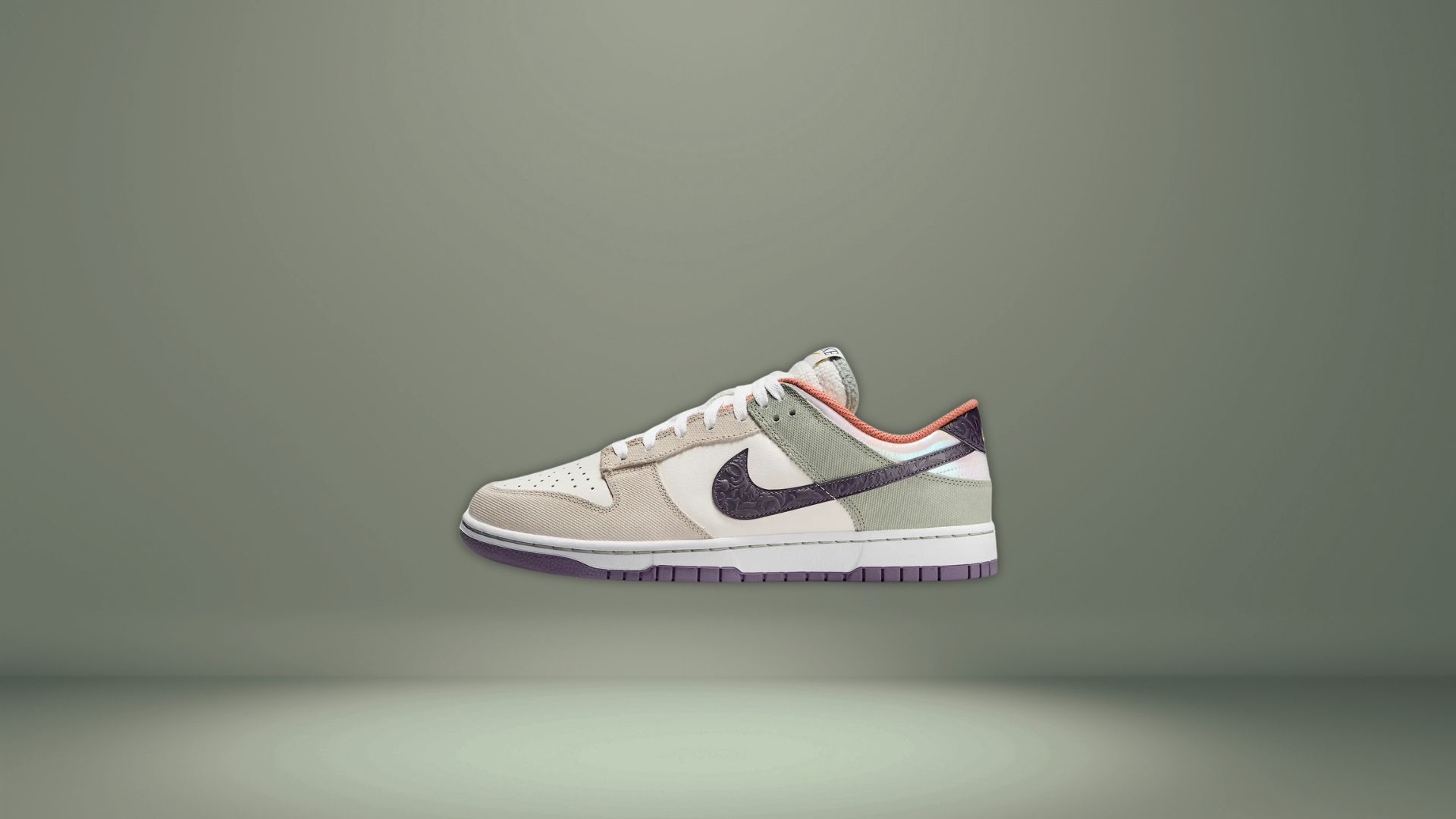 The Nike Dunks SE shoes are crafted from a unique blend of leather and textile and are dressed in muted pastel colors: cream, green, purple and orange (Image via Nike)