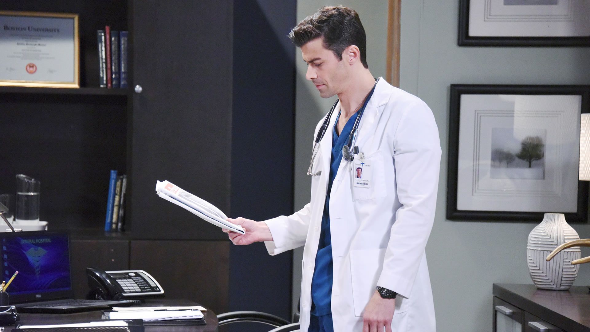 General Hospital&#039;s Griffin Munro checking patient papers. | Image Source: JPI