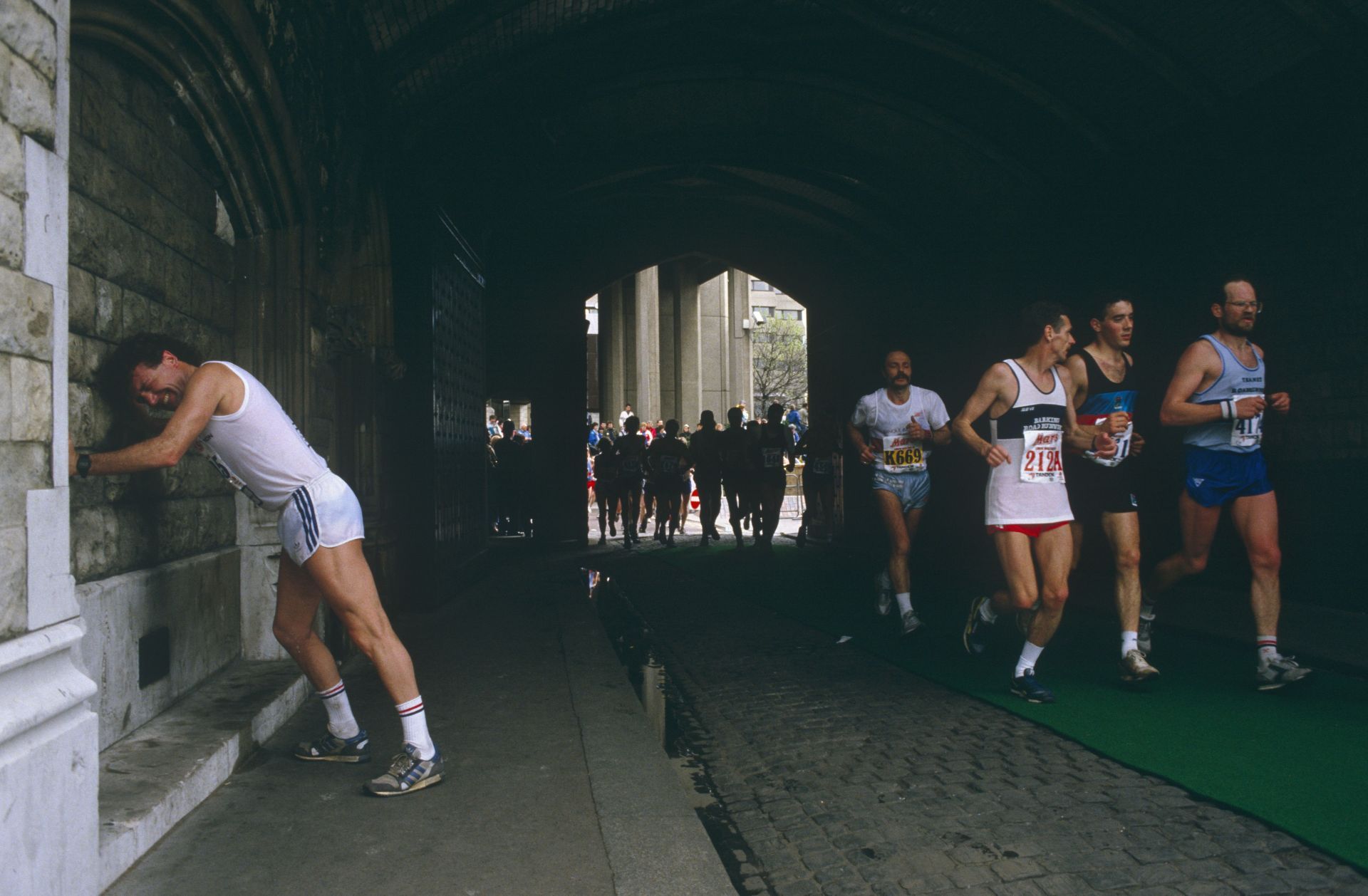 England - London - Athlete eases cramp during London Marathon - Source: Getty