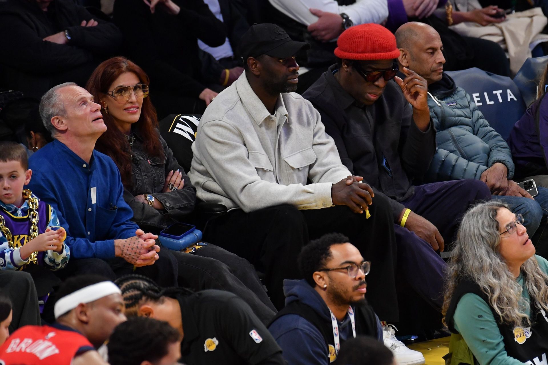 [L-R] Flea, Melody, Omar and The Bullitts in the audience (Image via Allen Berezovsky/Getty Images)