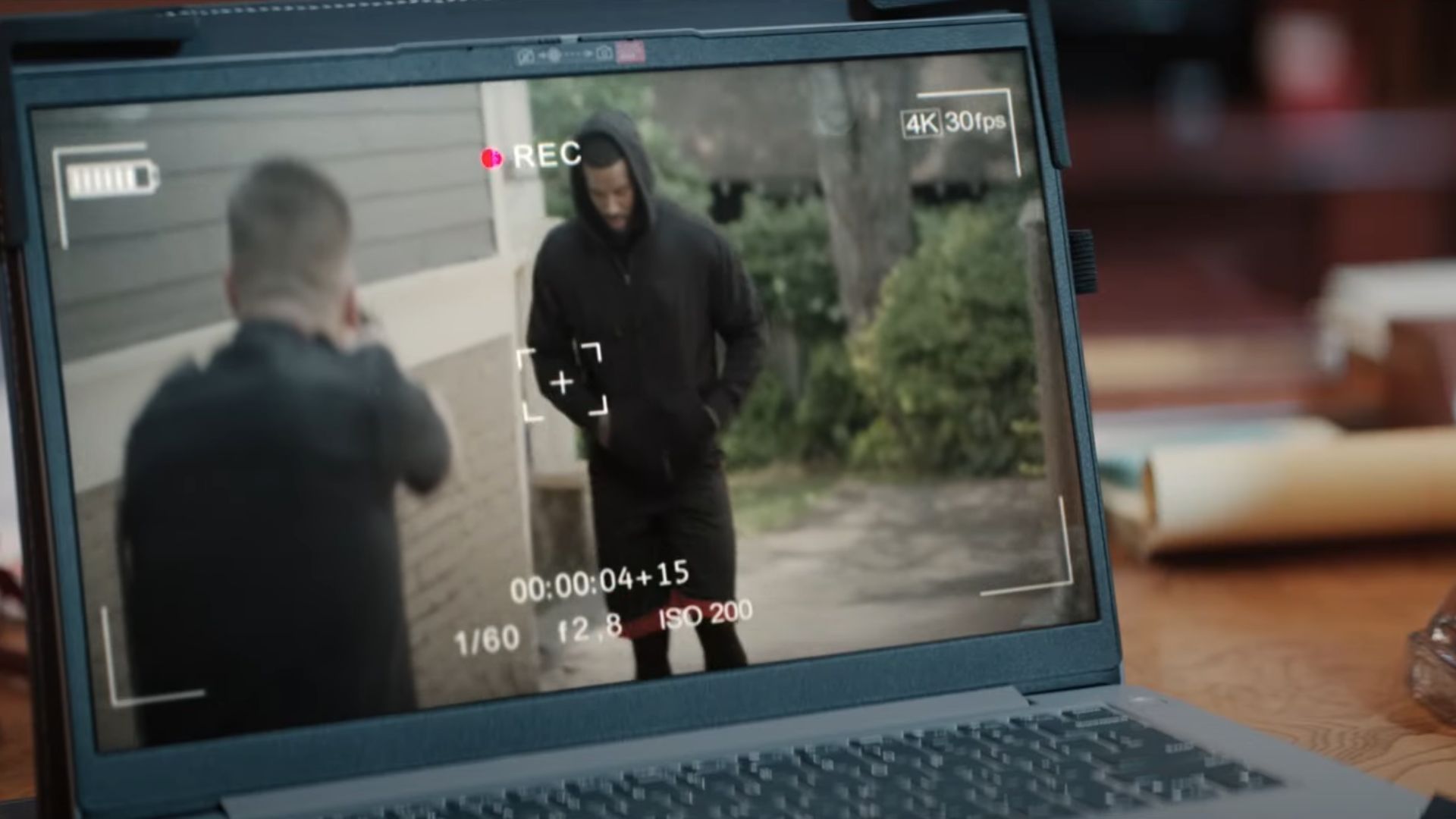 A recording plays on a laptop