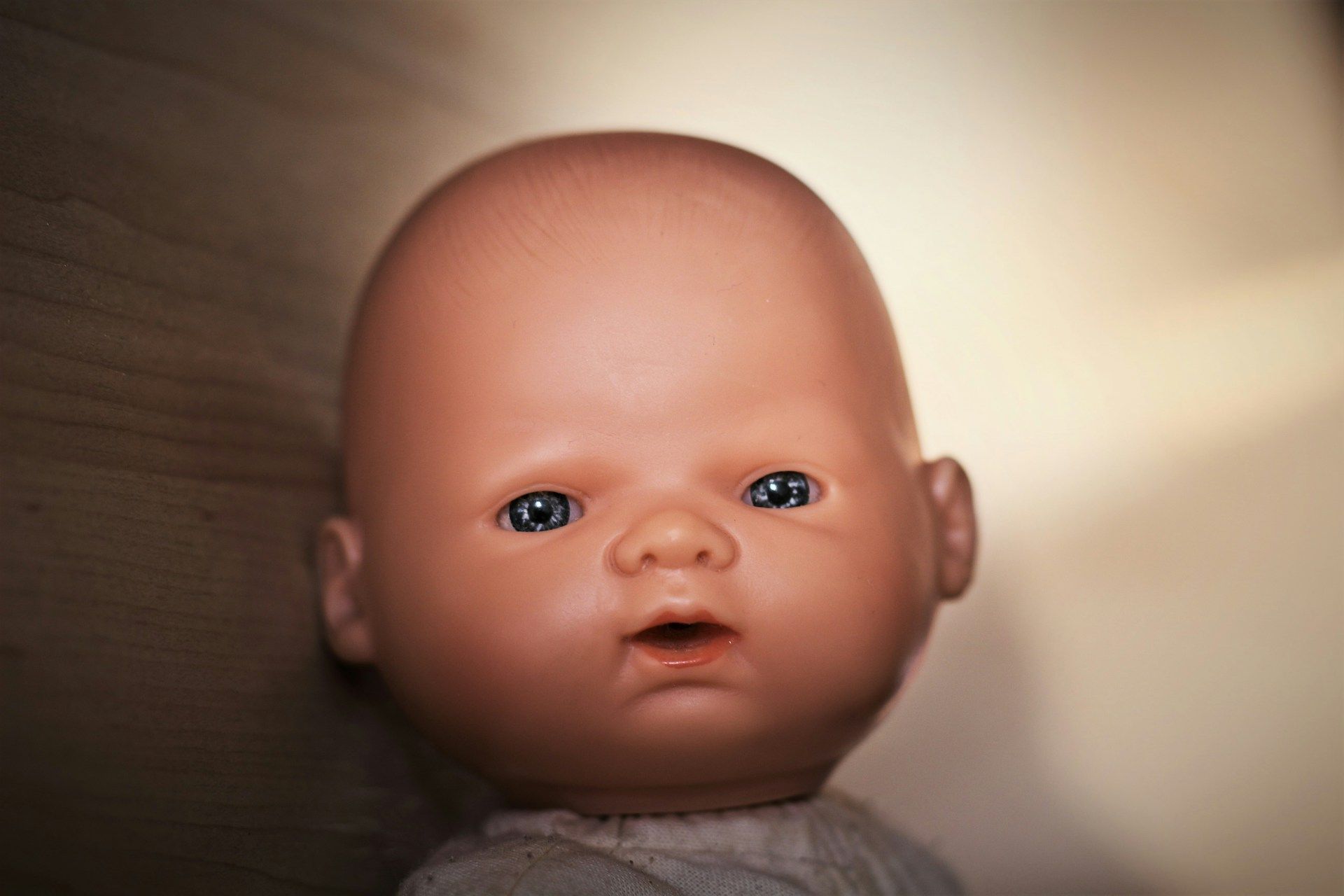 Image of a baby face in the form of a doll